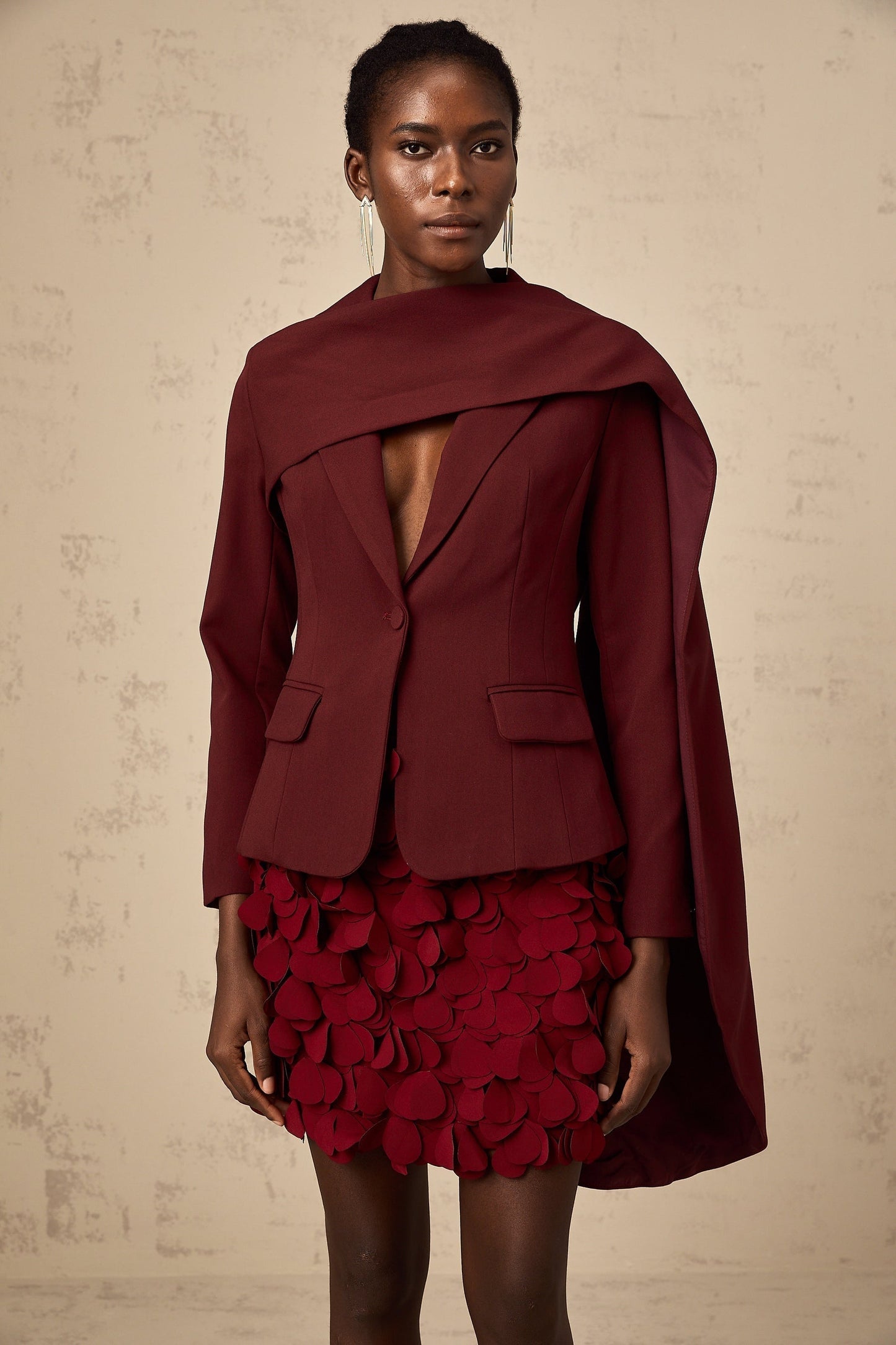 A burgundy jacket with shawllike detailing named Coralie in a rich wine color