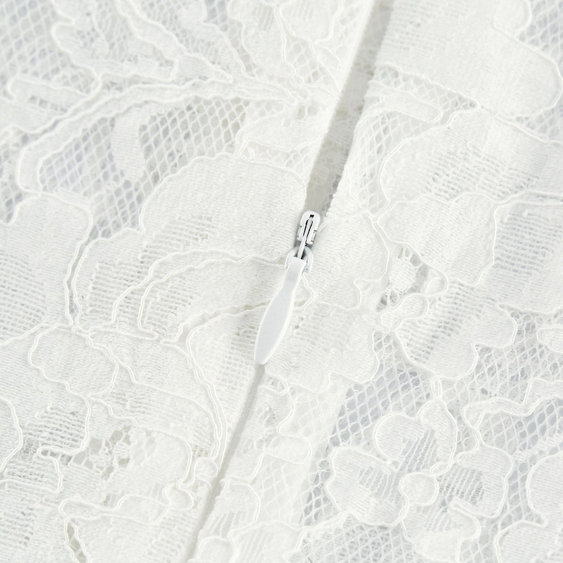 A Celine midi dress made of lace fabric featuring cutout details