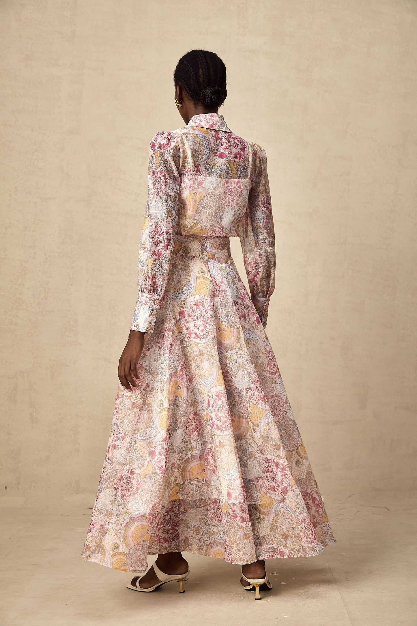 A cherry pink matching set featuring a patterned shirt and skirt with a floral or fruit print design