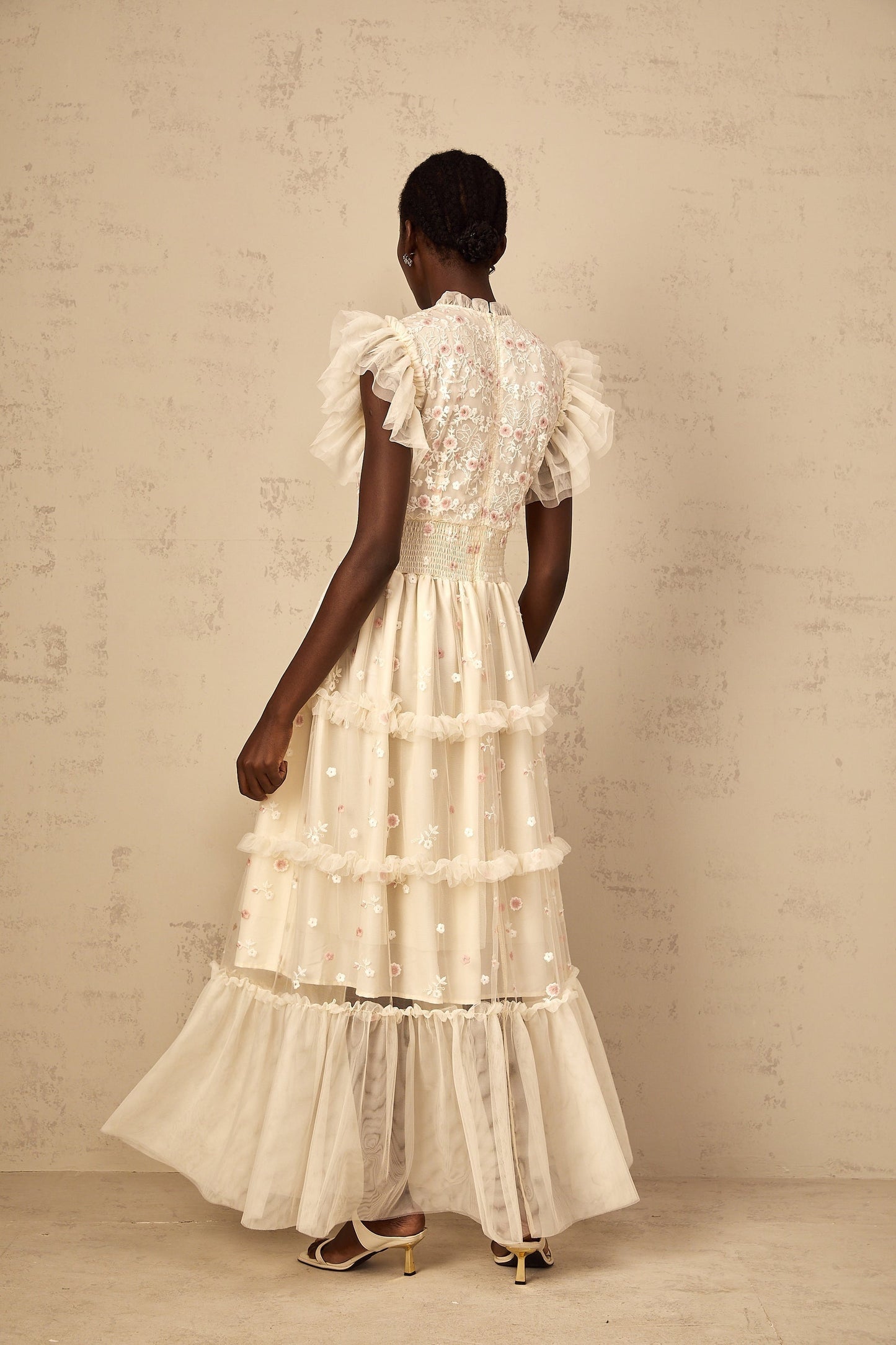 A cream white maxi dress for women with floral embroidery and tiered tulle skirt