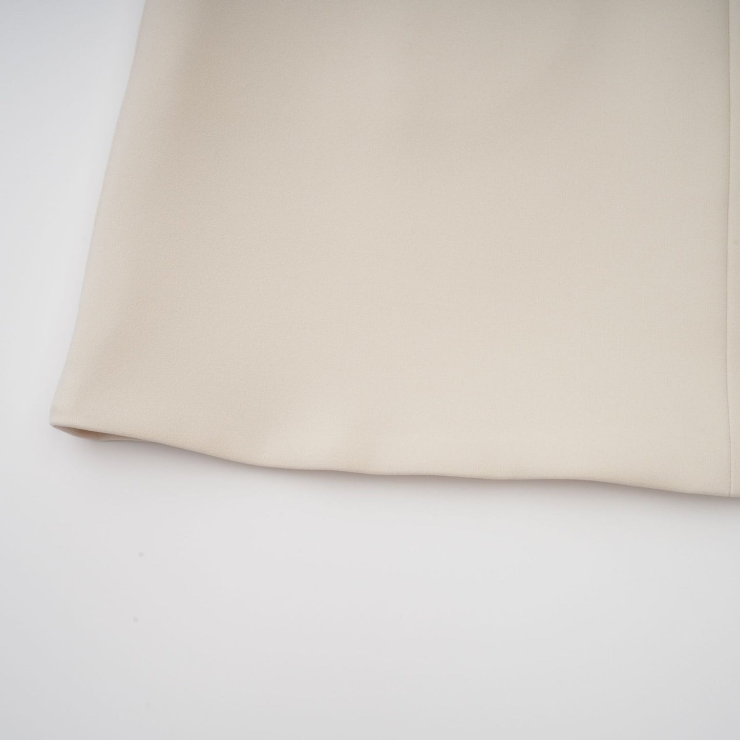 A creamwhite fitted mini dress by Chloé on a plain background