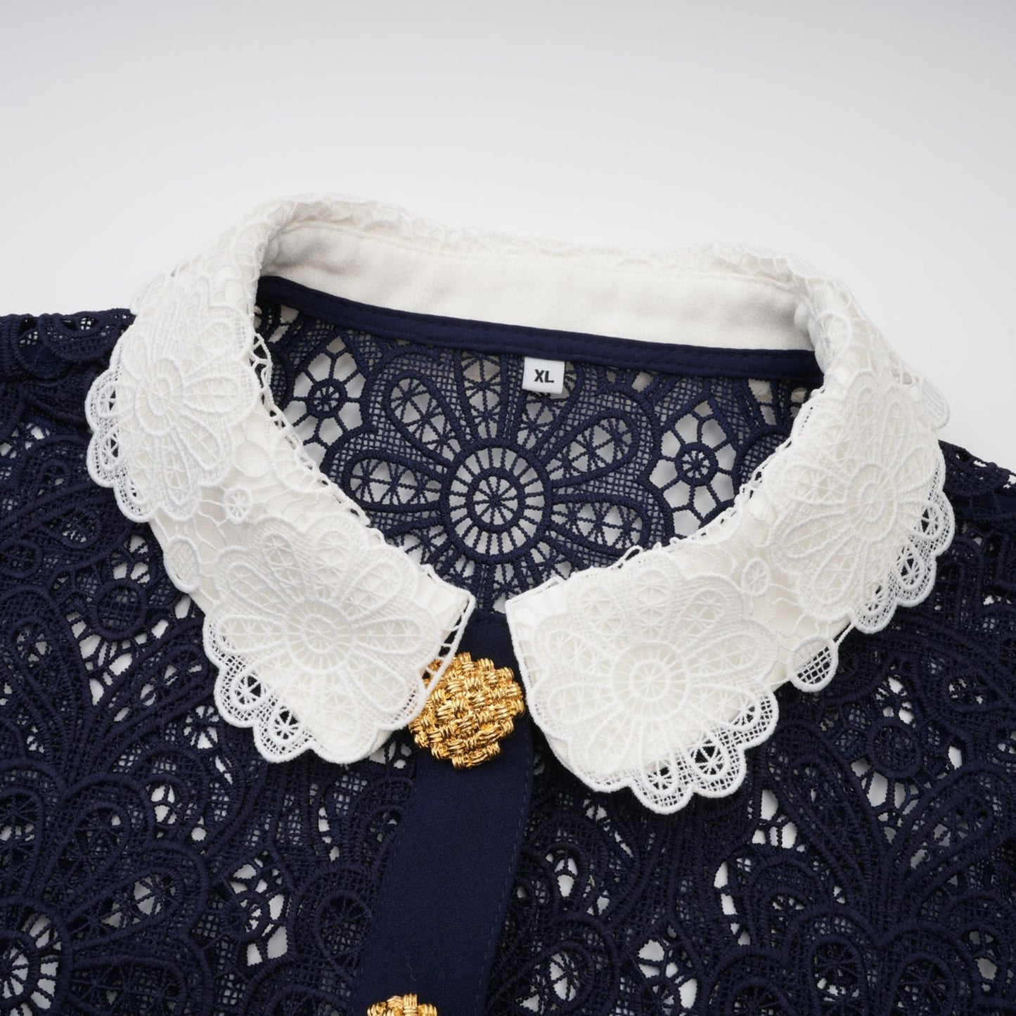 A dark blue midi dress with floral crochet lace pattern Ariane style