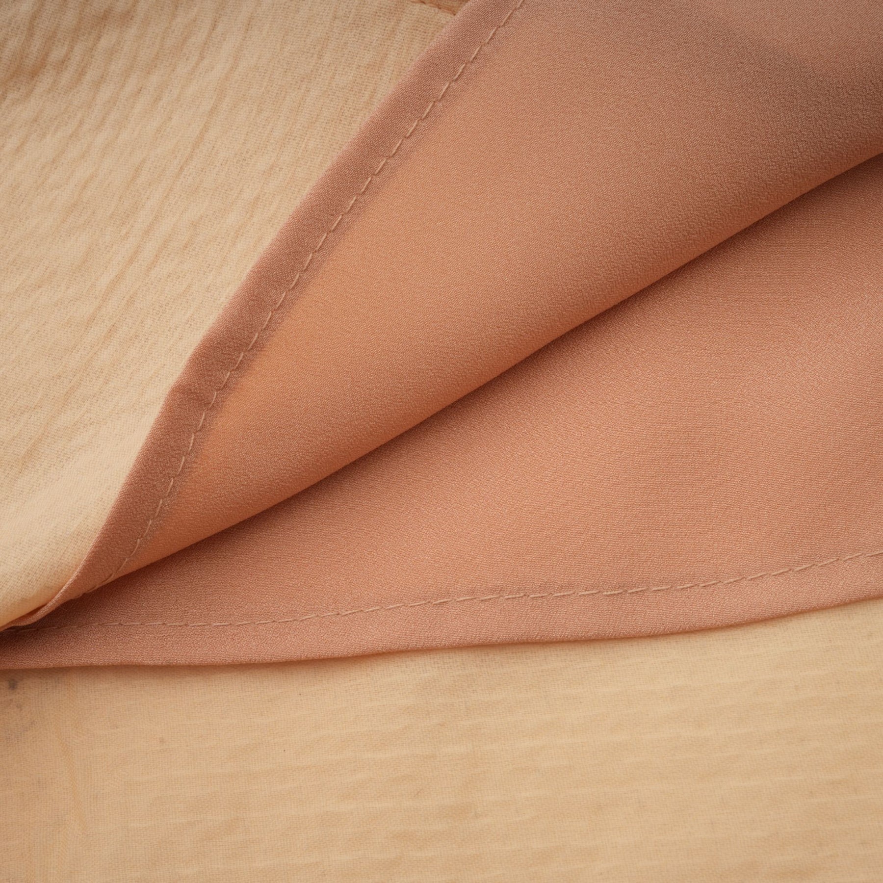 A elegant midi dress with a shimmering sequin design and faux pearl embellishments featuring a fitted silhouette and luxurious ornate appearance