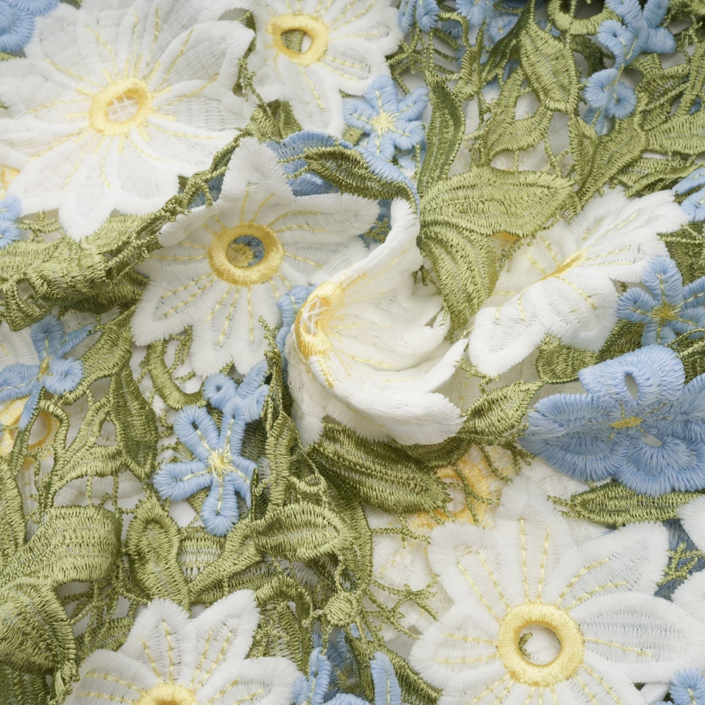 A feminine midi dress with floral embroidery and hollowcarved details featuring a delicate pattern throughout the fabric