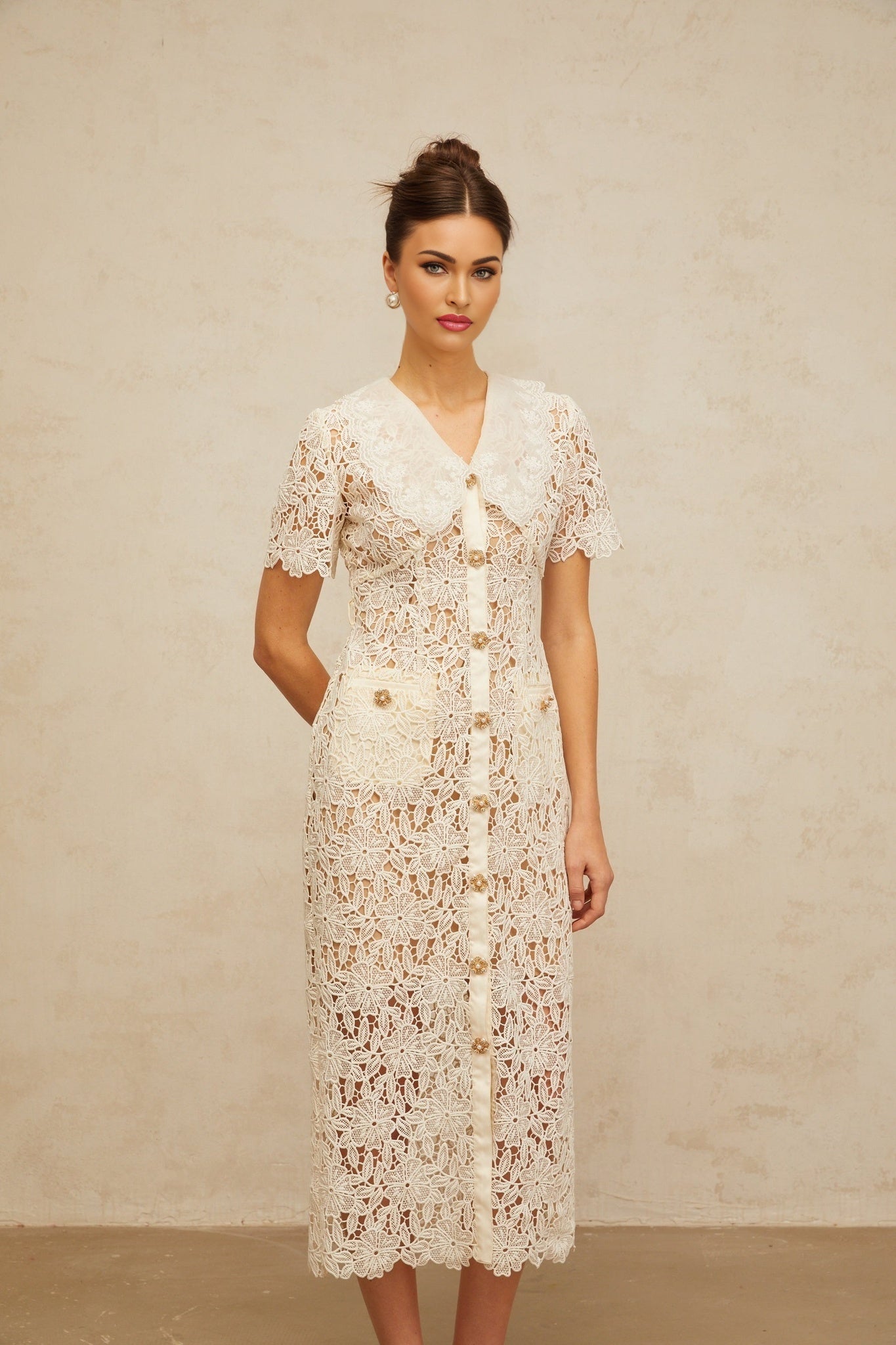 A feminine offwhite midi dress with corded lace details and a flattering silhouette named Sophie