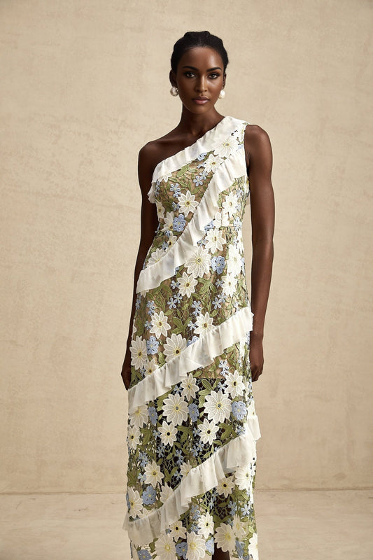 A floral embroidered midi dress with a feminine silhouette named Clemence featuring delicate floral patterns on a light colored fabric