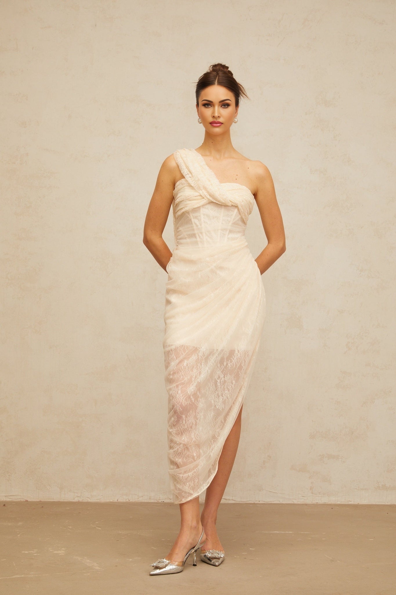 A floral lace midi dress with gathered tulle panels named Petunia featuring a delicate floral pattern and a feminine silhouette