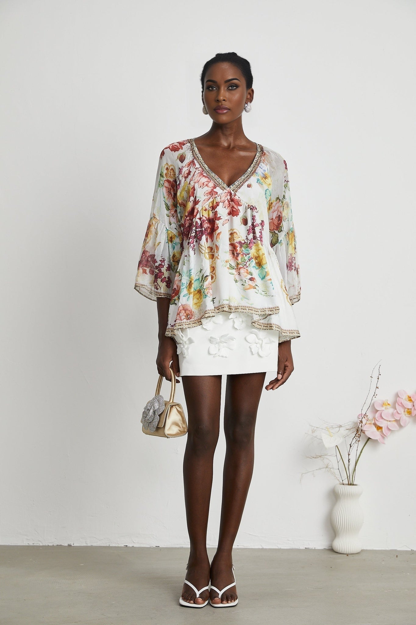 A floral print blouse named Yvonne with a V neckline