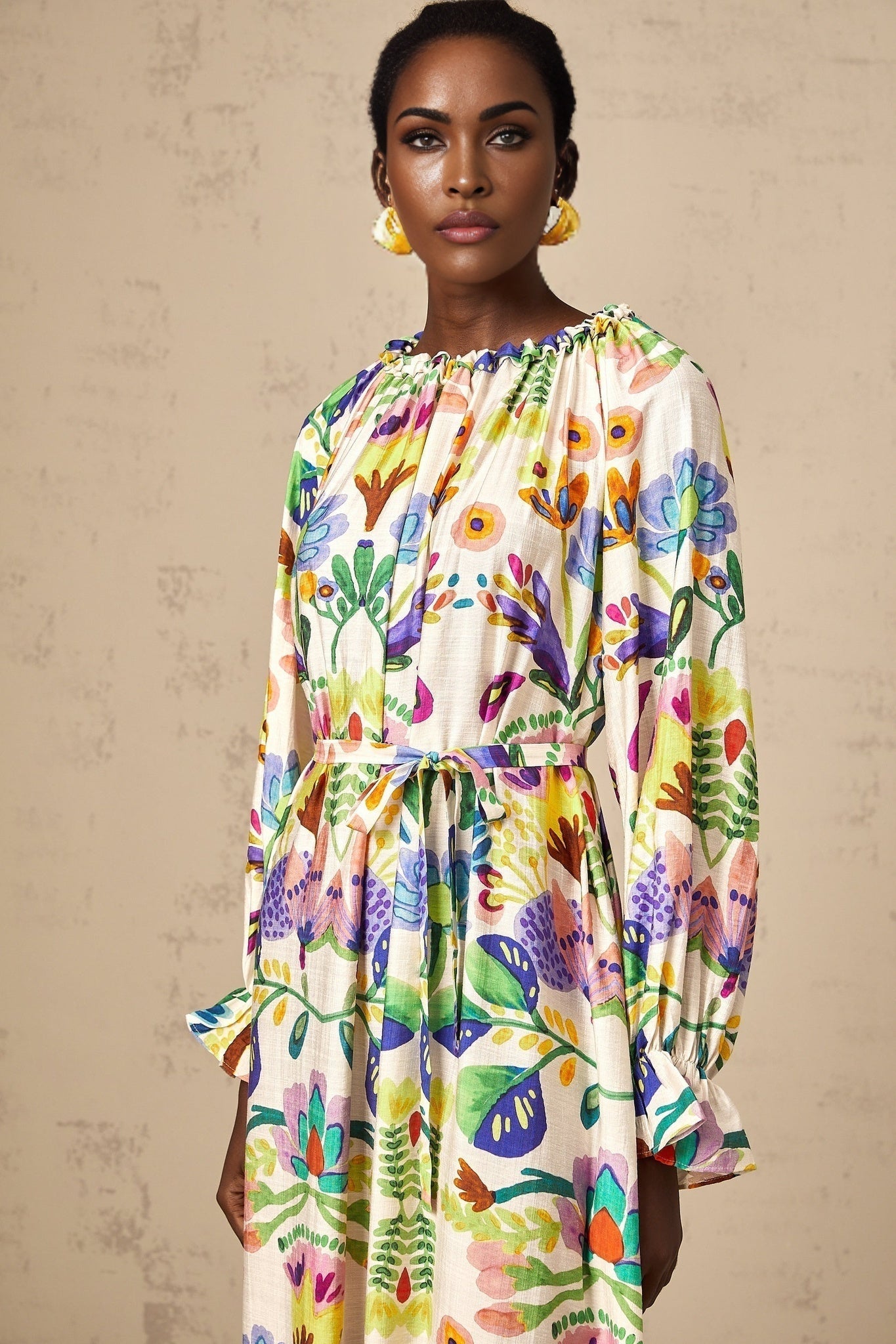 A flowy midi dress with a paisley print pattern on poplin fabric featuring an Adalasia design