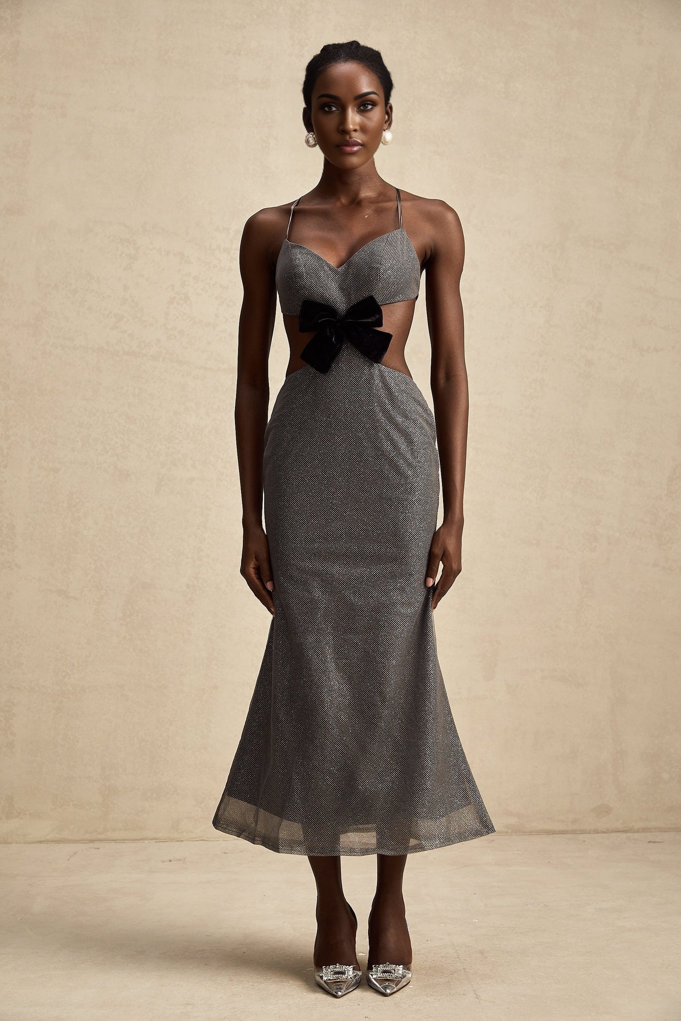 A glamorous midi dress with open back and sequin embellishments named Violaine
