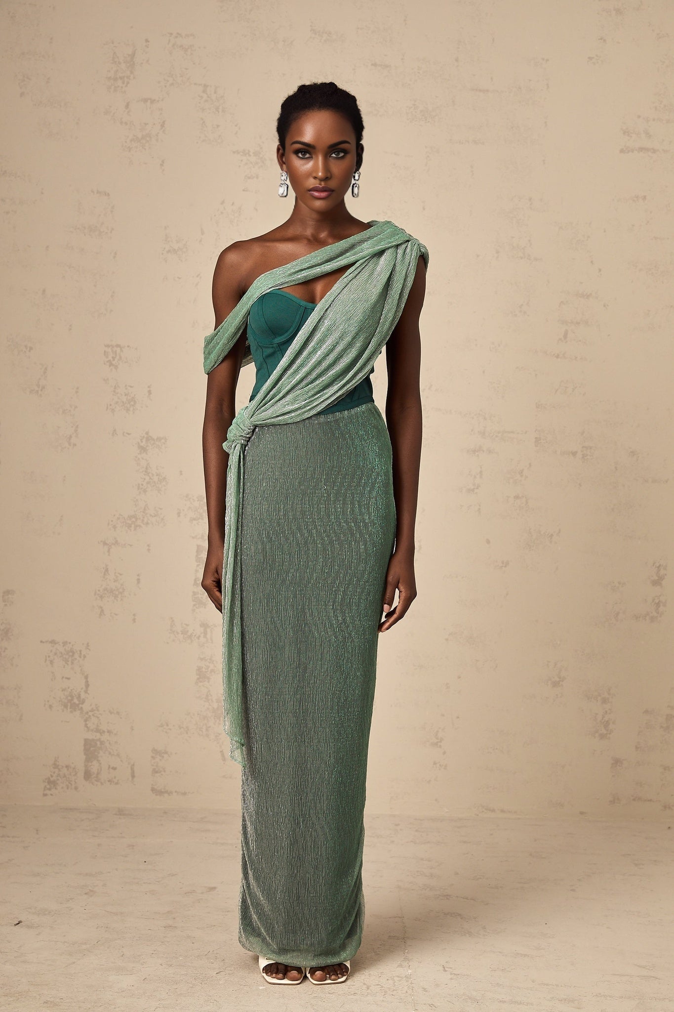 A green maxi dress with a corsetstyle top featuring a ribbon design named Delphine