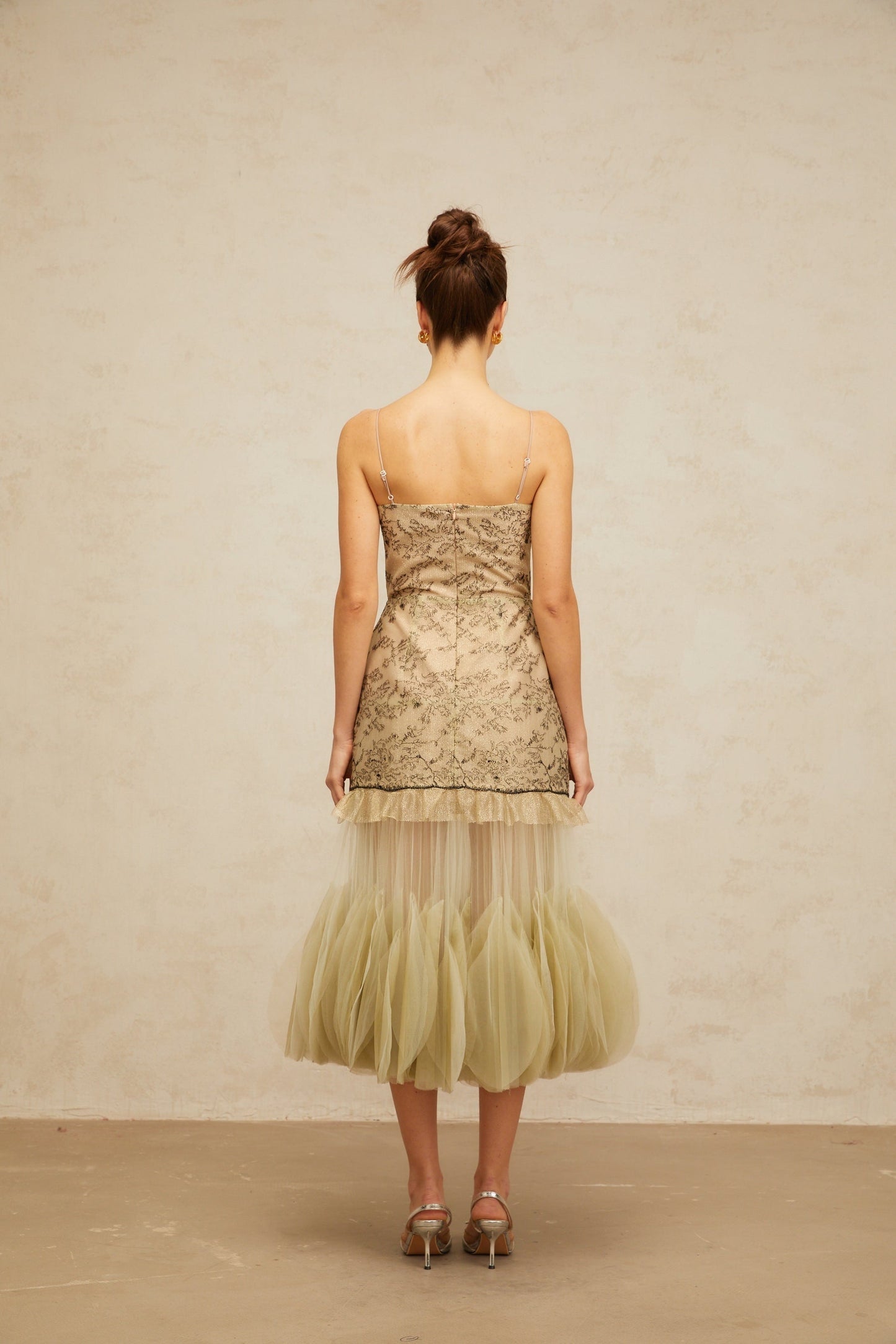 A green midi dress with embroidered details and panelled design named Mathilde