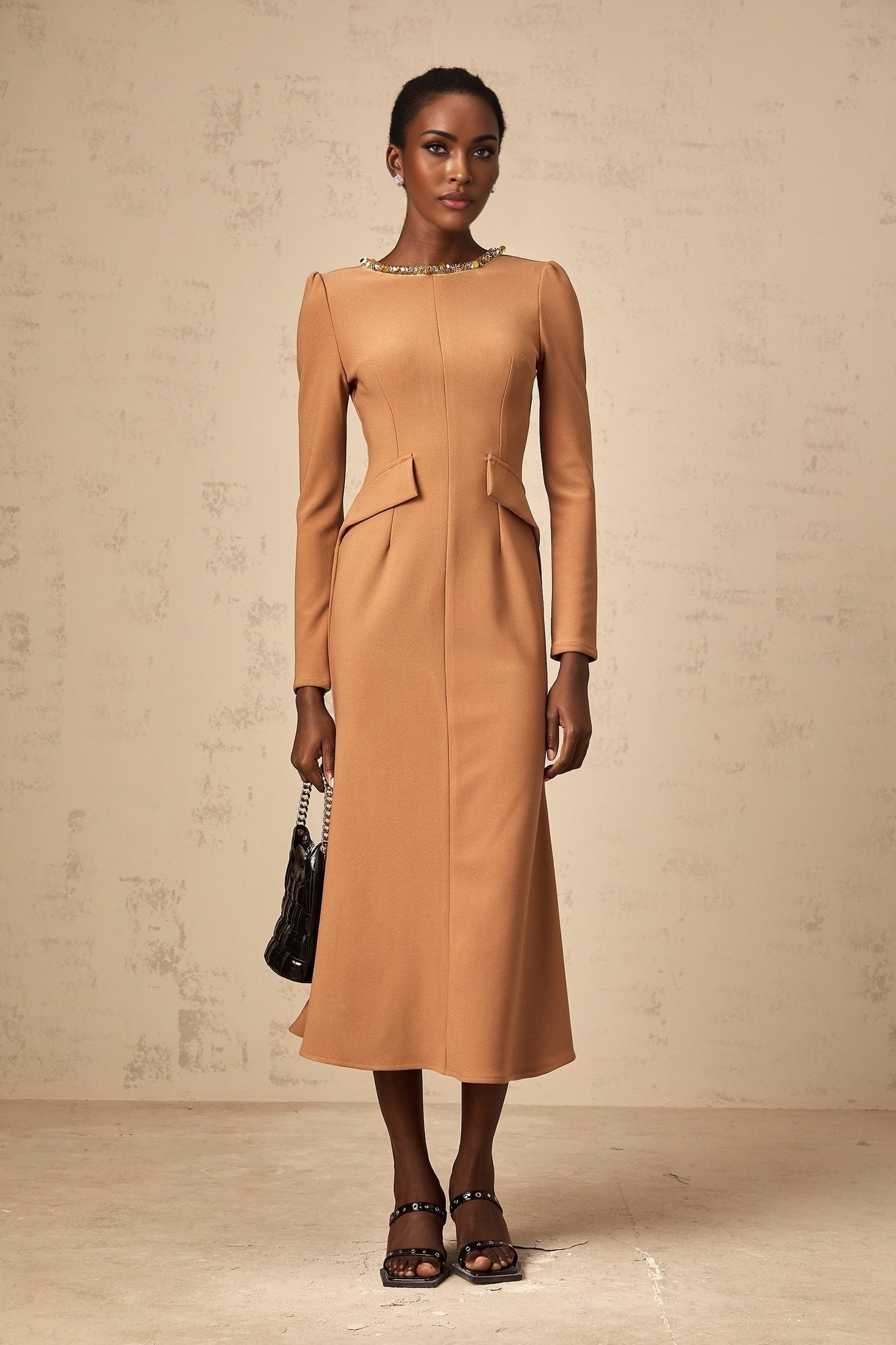 A khaki midi dress with sequin embellishments named Doriane on a plain background