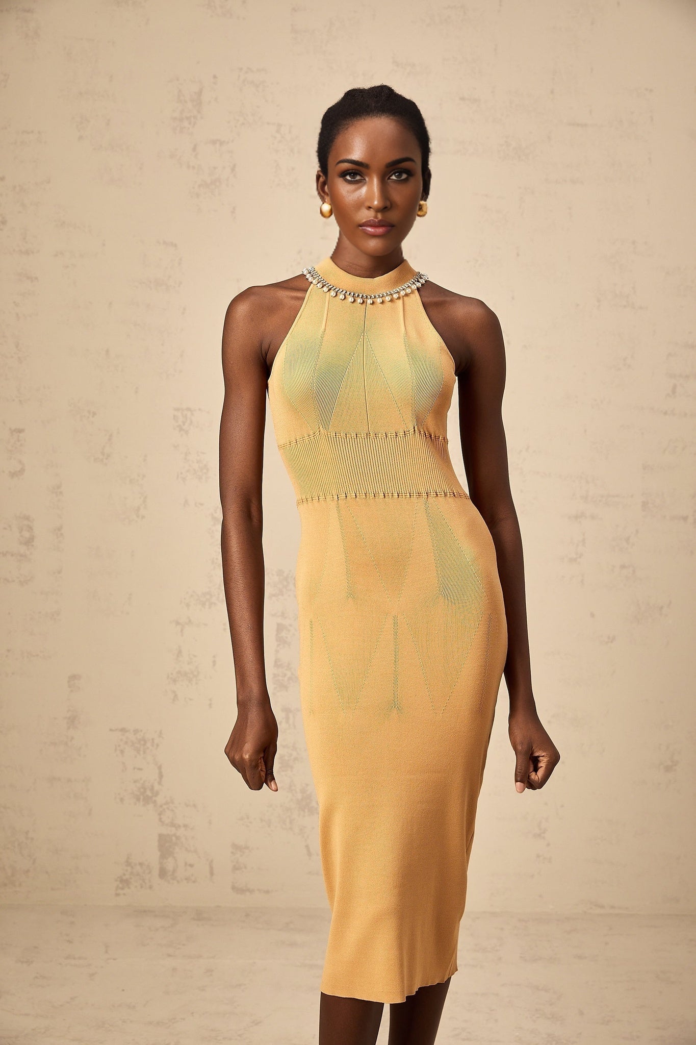 A knit midi dress with faux pearl embellishments named Juliette