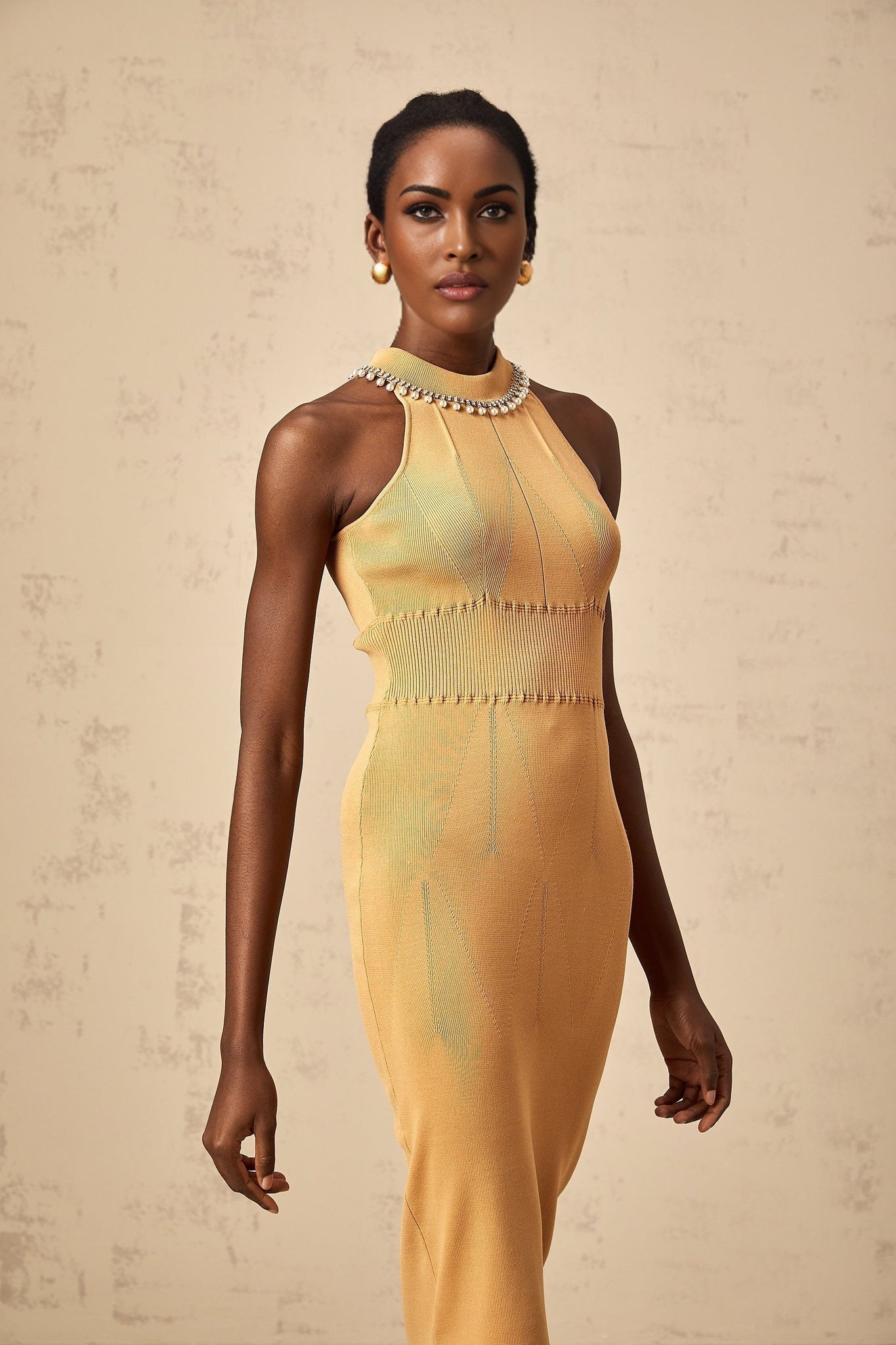 A knit midi dress with faux pearl embellishments named Juliette