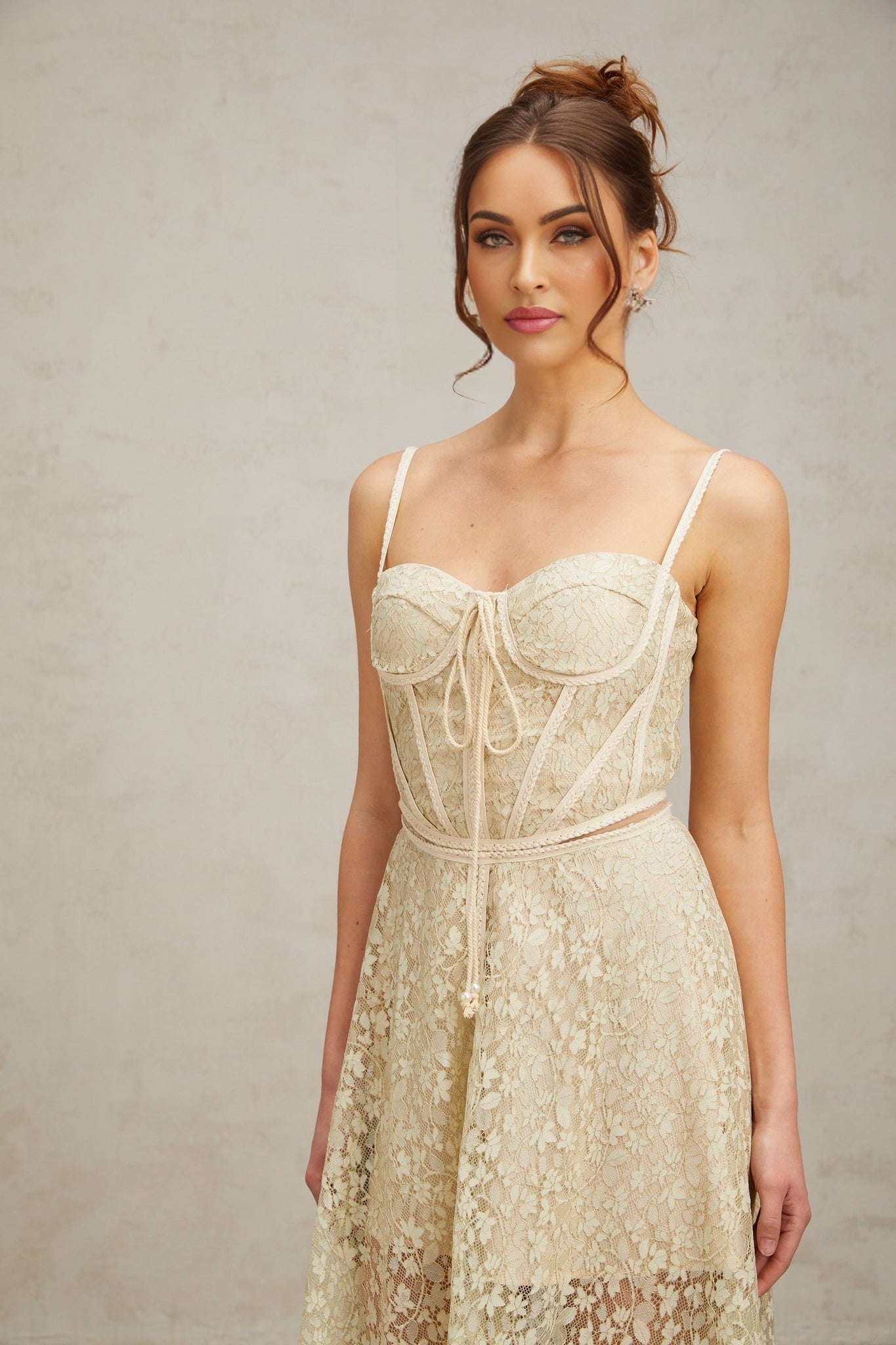 A light green midi dress with floral embroidery called Yasmine