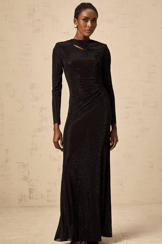 A long black mesh maxi dress with ruched detailing and rhinestone embellishments