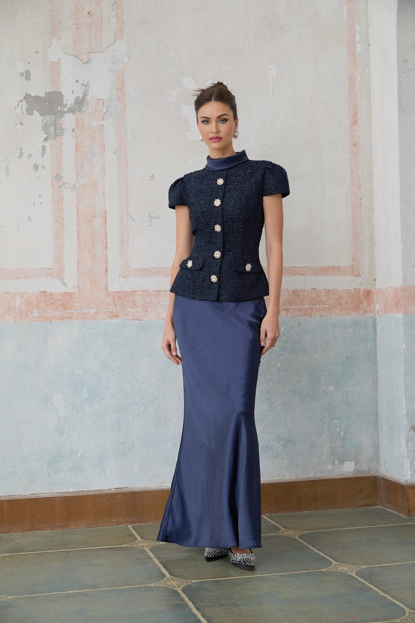 A long blue maxi dress with a peplum waist and panelled design featuring the Josette style