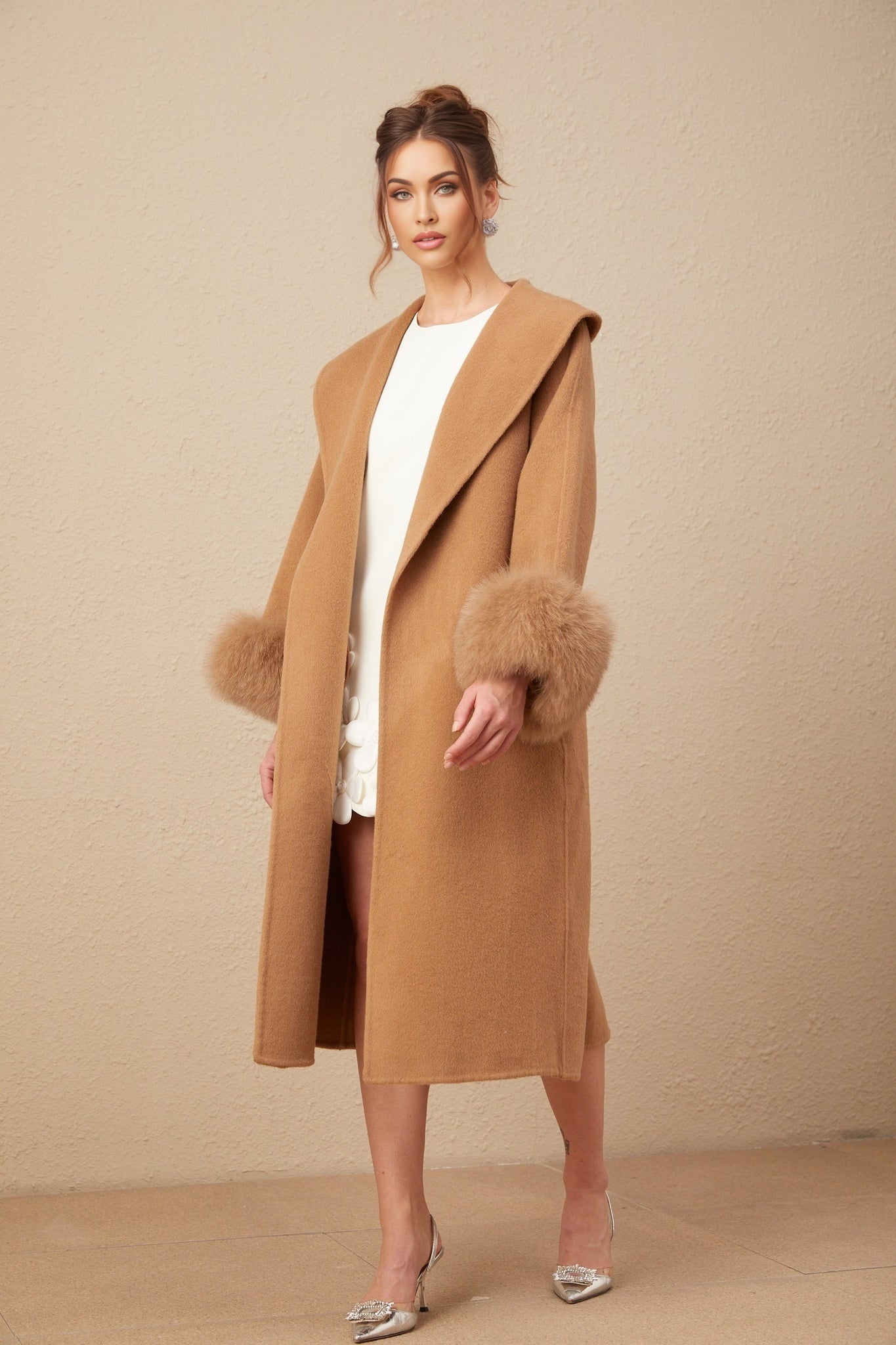 A long brown felted wool wrap coat with a loose fit and open front style