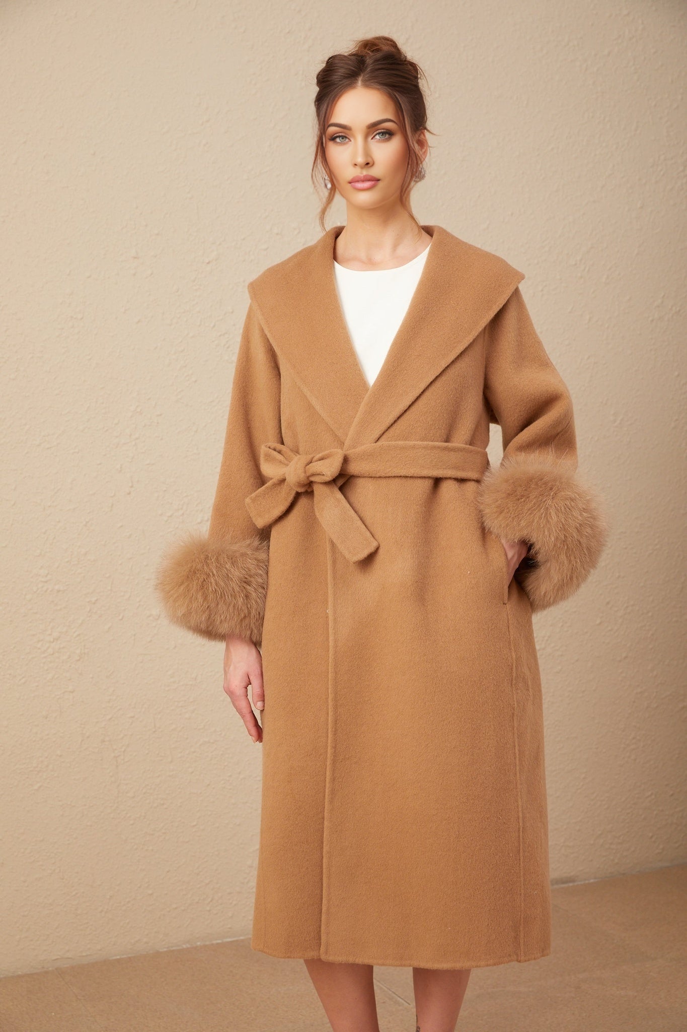 A long brown felted wool wrap coat with a relaxed silhouette and open front design