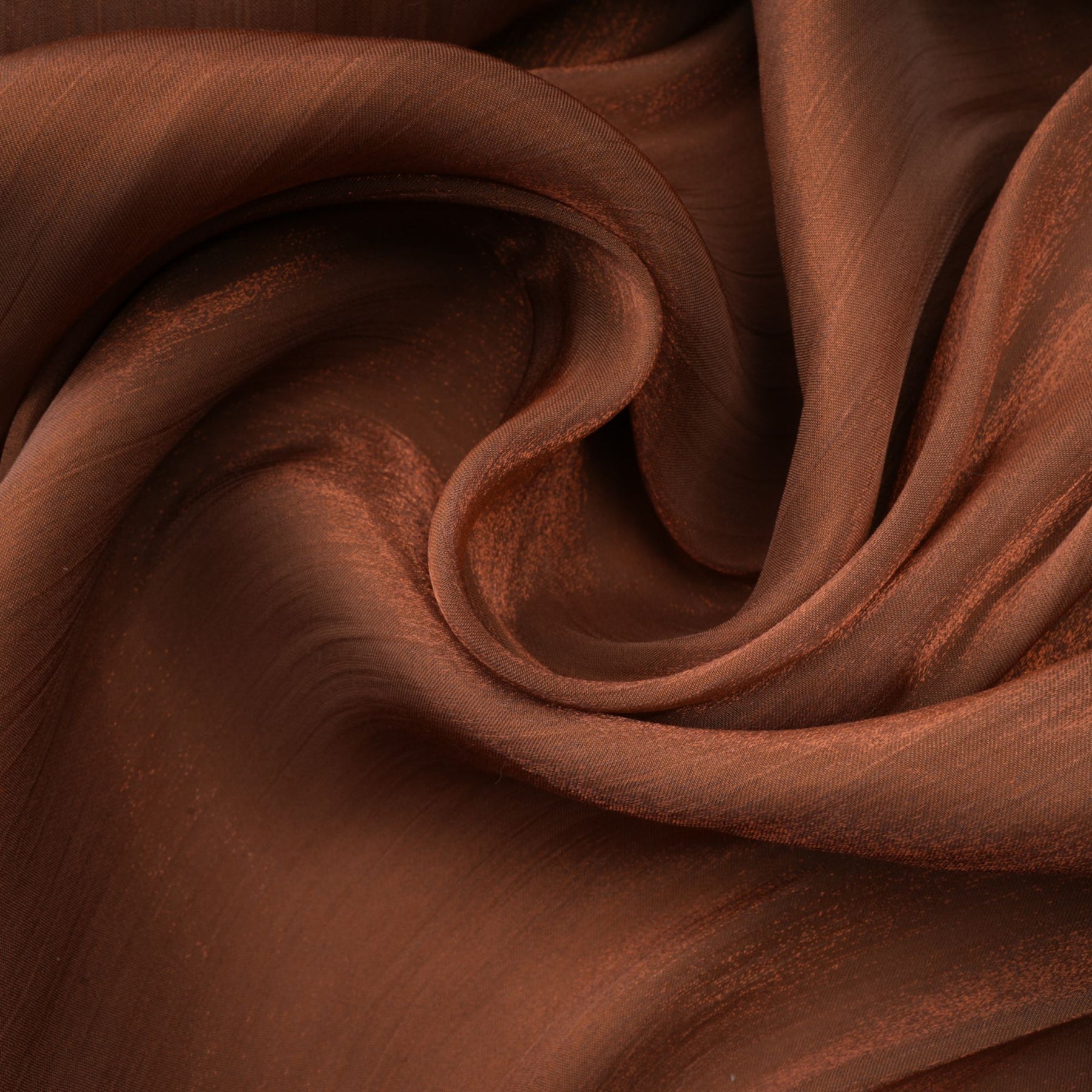 A long brown pleated satin maxi dress with a flowing silhouette named Mila