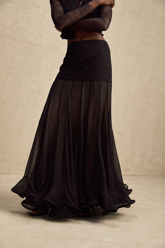 A long flowy maxi skirt with a ruffled waistline and pleated tulle fabric in a soft rayon material named Jacqueline