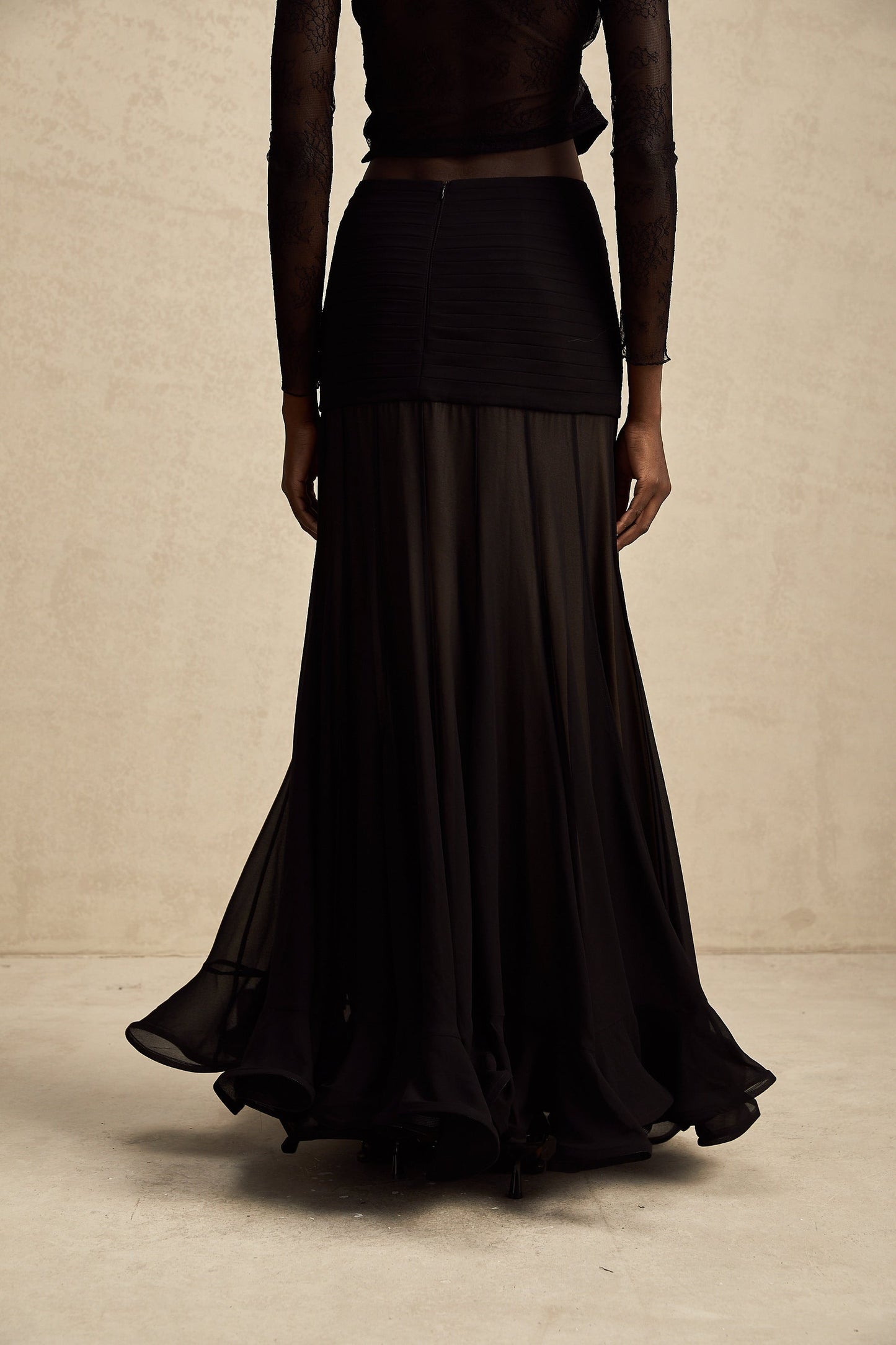 A long flowy maxi skirt with ruffles and pleats made of rayon and tulle fabric in a feminine Jacqueline style