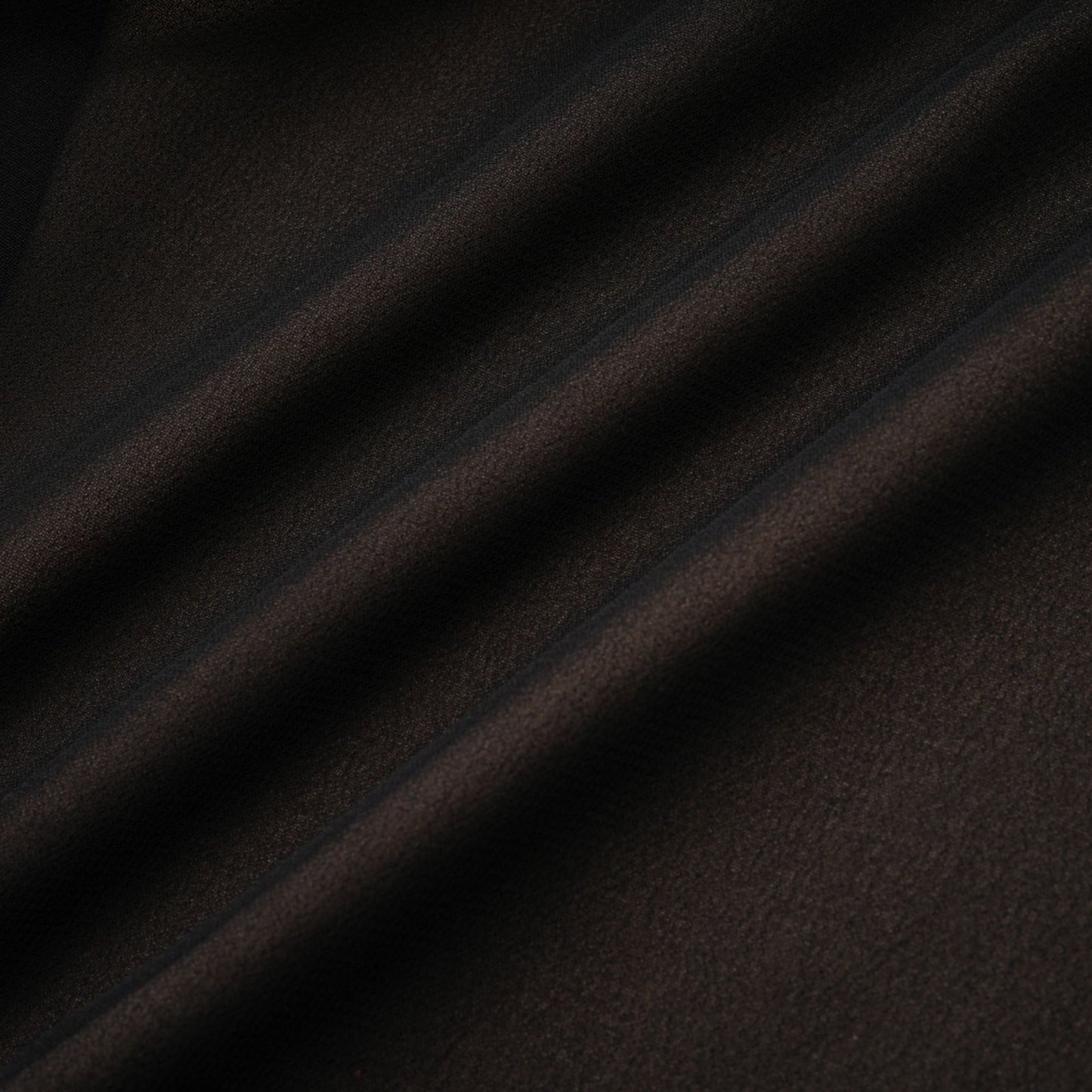 A long flowy maxi skirt with ruffles and pleats made of rayon and tulle fabric in a light color