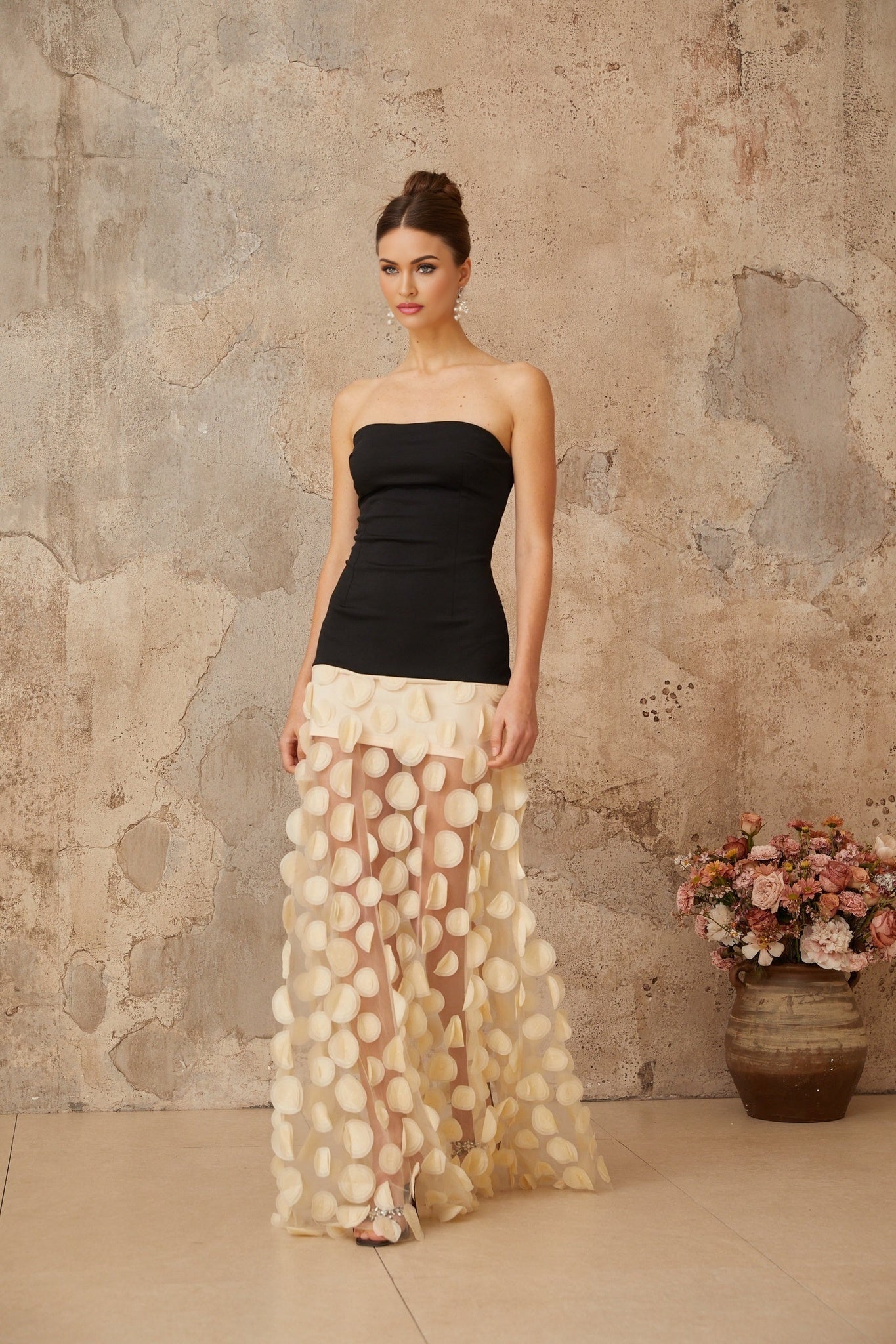 A long maxi dress with contrasting colors featuring a three dimensional polka dot pattern named Xenia