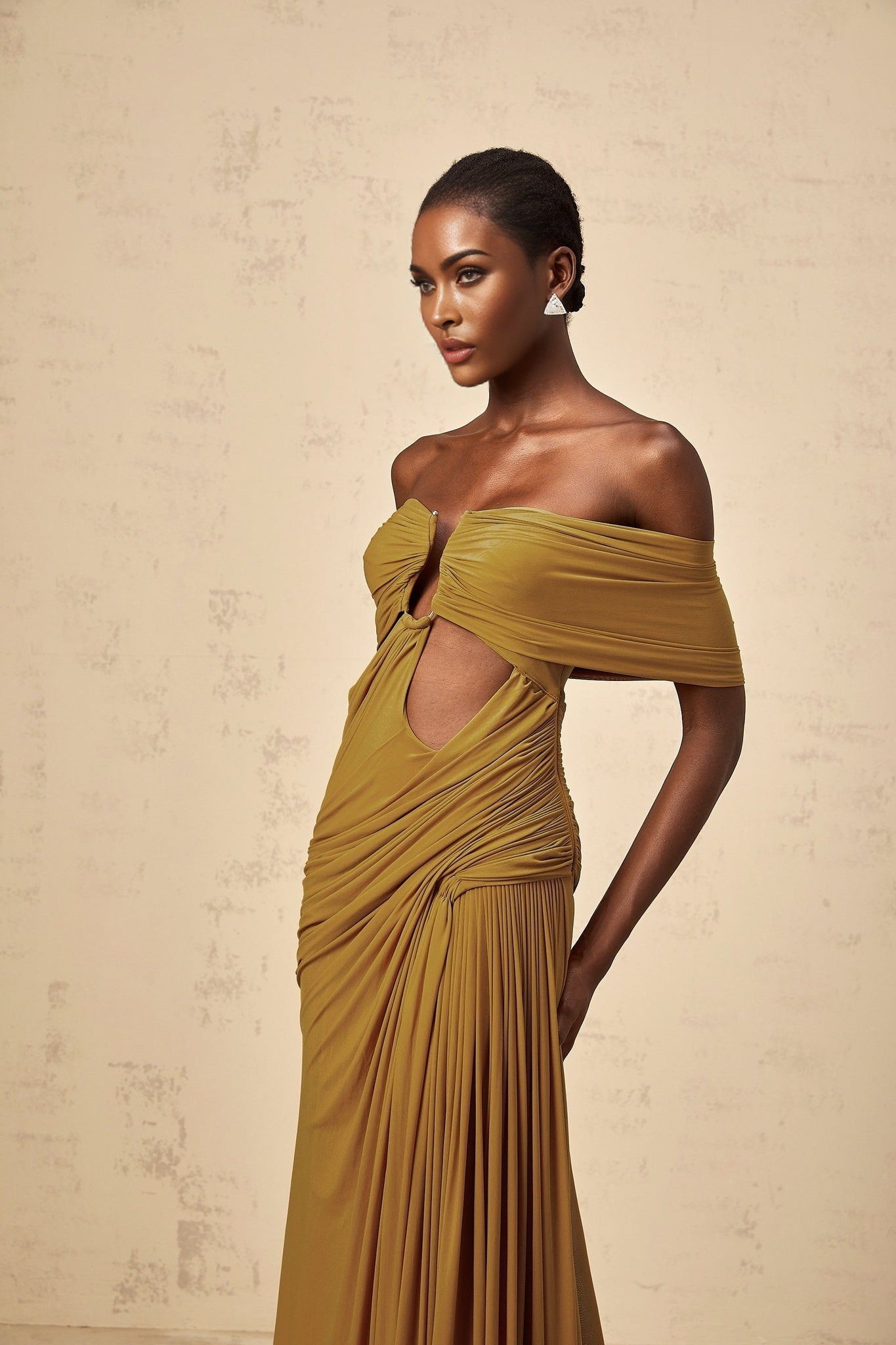 A long ocher maxi dress with offshoulder design featuring cutout details and ruched fabric Ludivine style