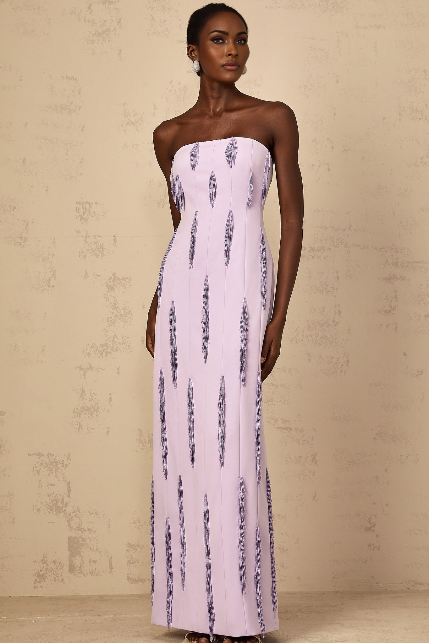 A long purple maxi dress with beaded fringe details named Émilie