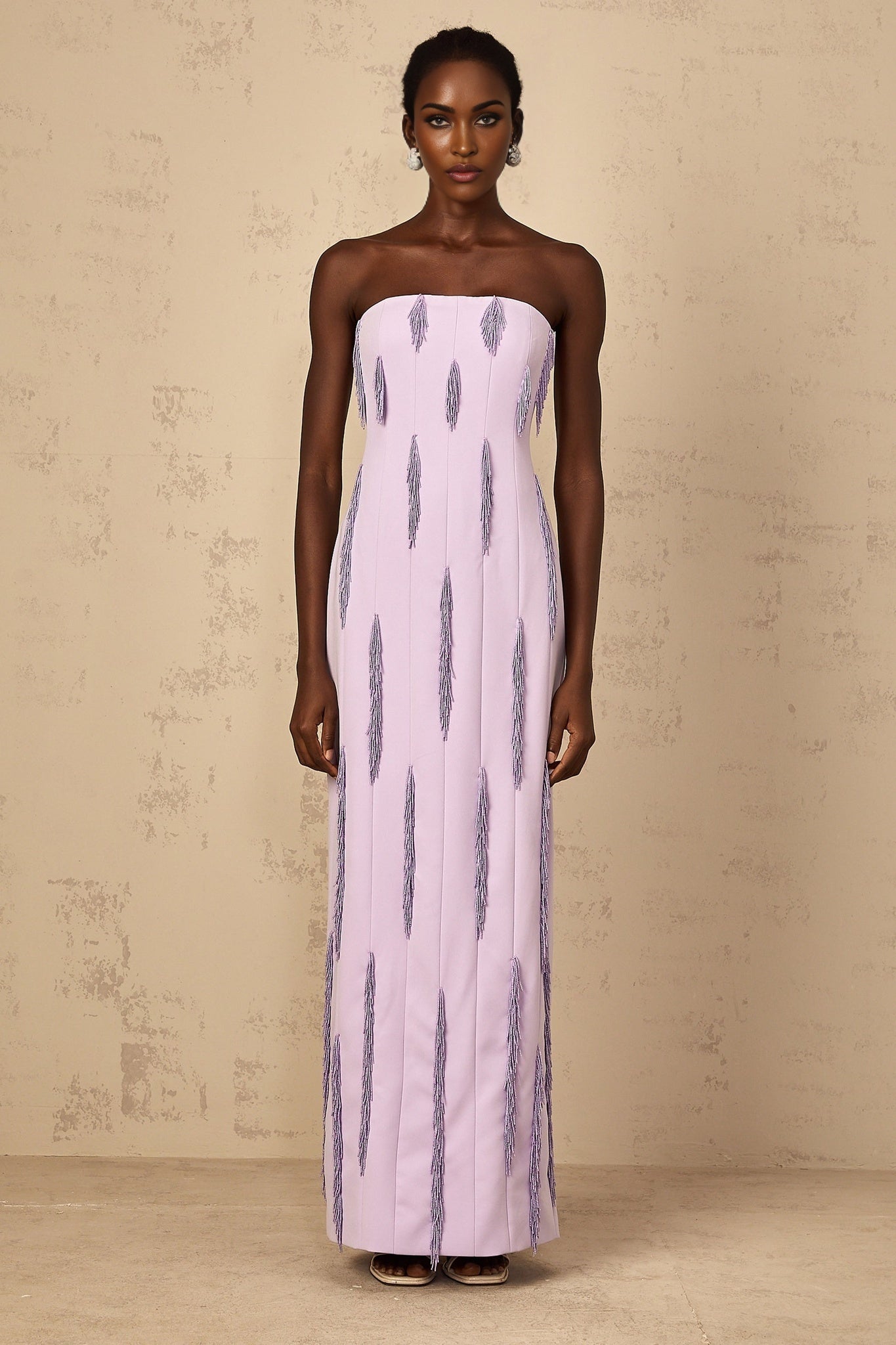 A long purple maxi dress with beaded fringe details named Émilie