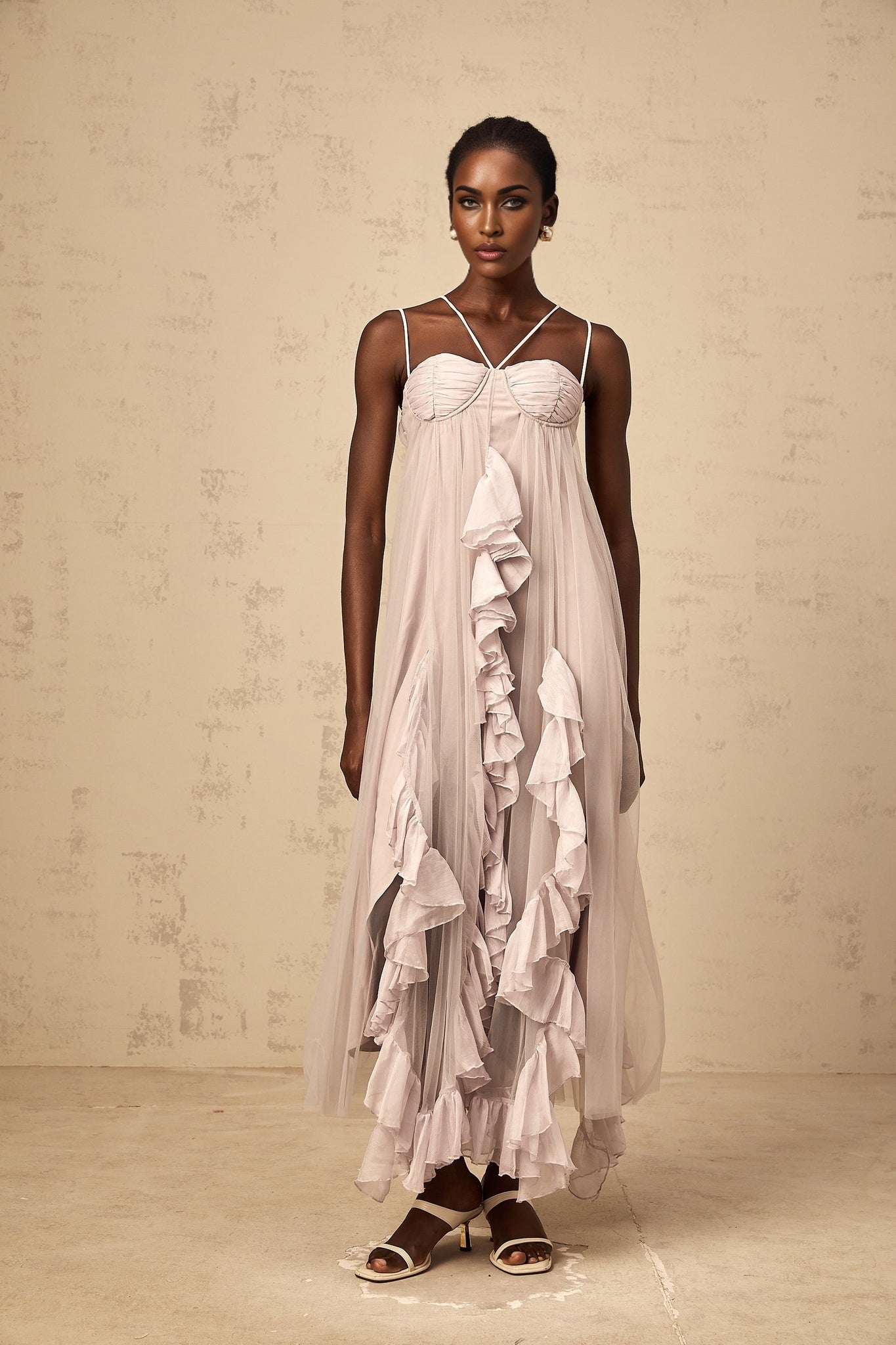 A long purple maxi dress with layered ruffles and a tulle skirt named Colette