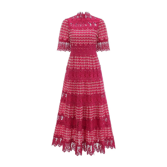 A long red maxi dress with scalloped lace panels featuring a feminine and elegant design