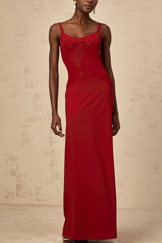 A long red maxi dress with sheer tulle panels designed by Celine
