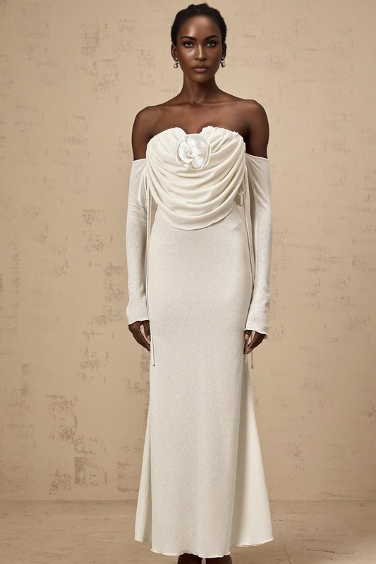 A long strapless maxi dress with a ruched bodice and floral applique details featuring a Julia design in a feminine silhouette