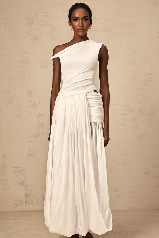 A long white maxi dress with a single shoulder strap and shirred panel detail on the bodice