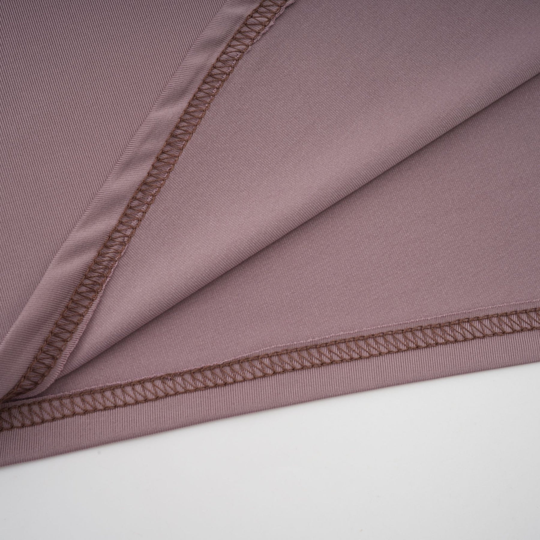 A long white maxi dress with a wavy lace pattern called the Athena featuring a fulllength skirt and intricate design details