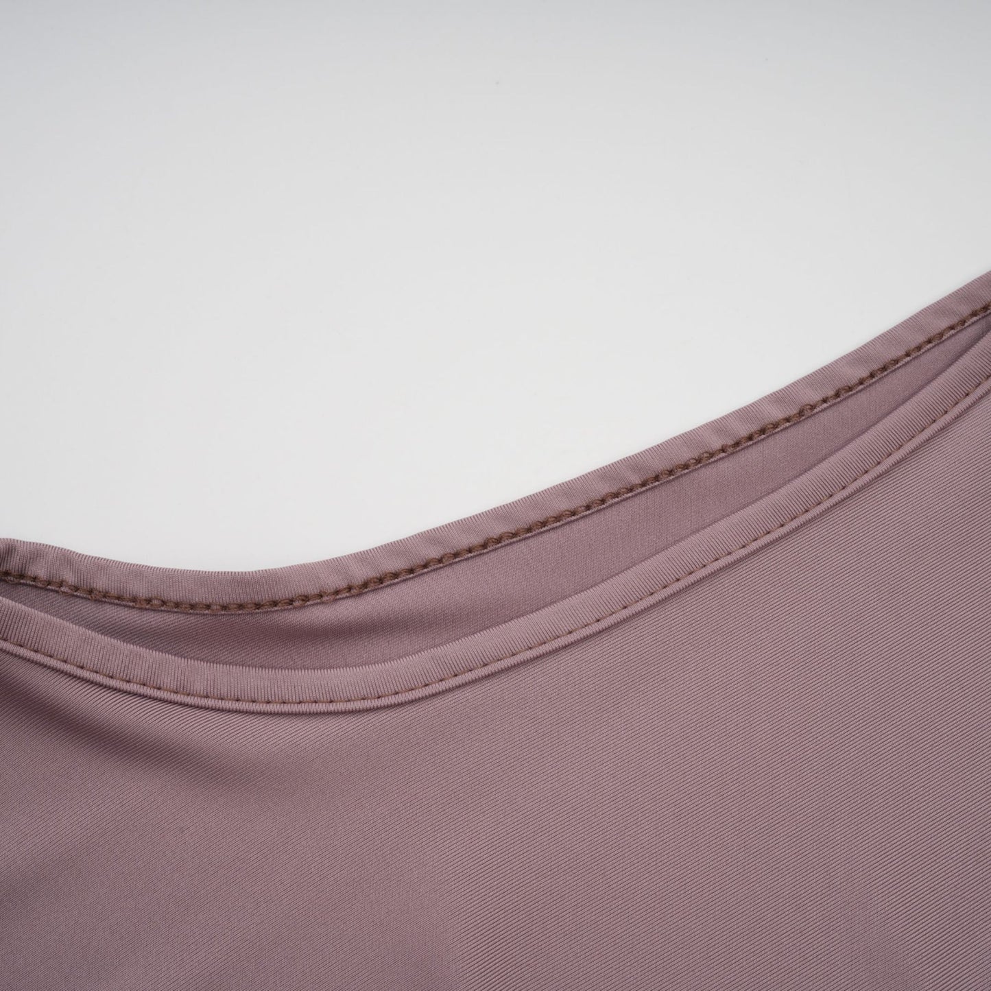 A long white maxi dress with a wavy lace pattern featuring a flowy silhouette and delicate details