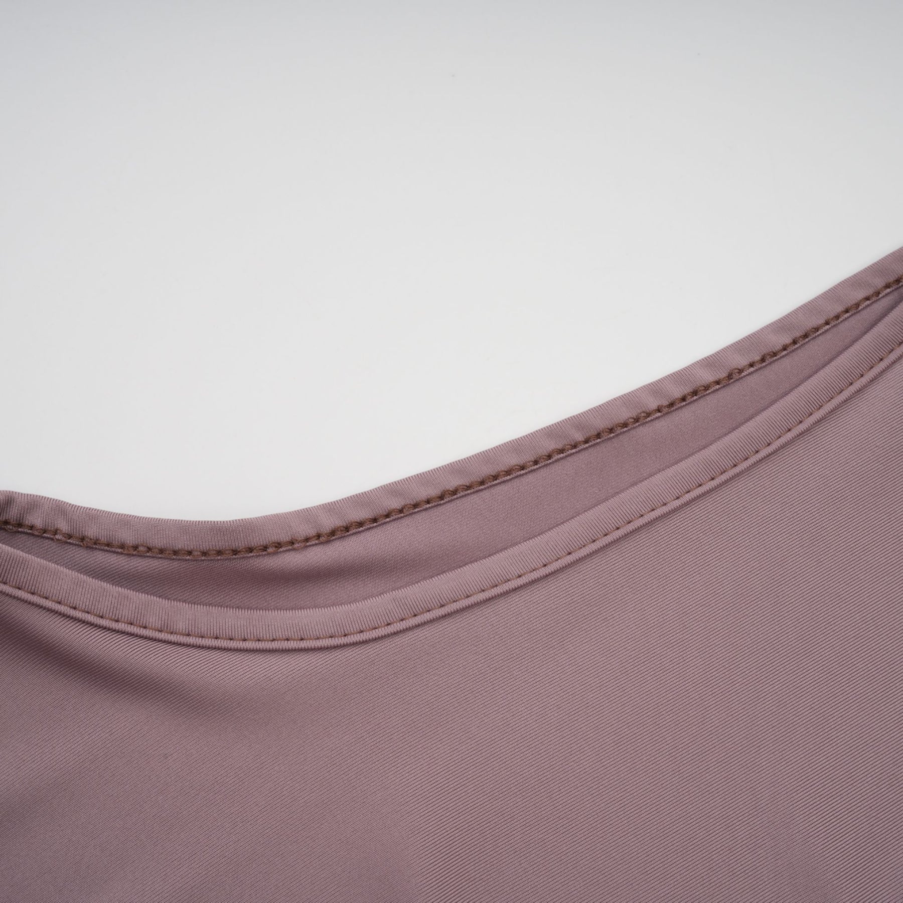 A long white maxi dress with a wavy lace pattern featuring a flowy silhouette and delicate details