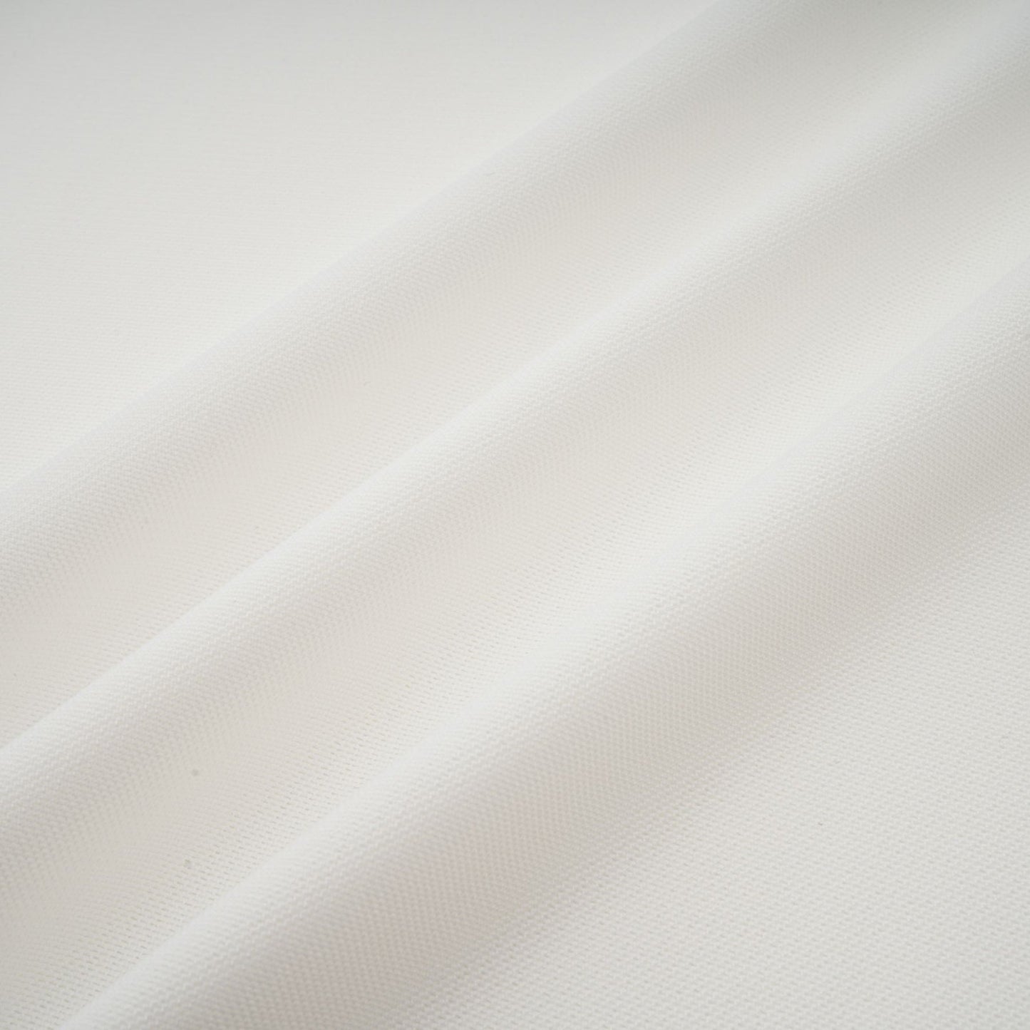 A long white maxi dress with tulle panelling details named Nathalie shown on a model or mannequin against a plain background