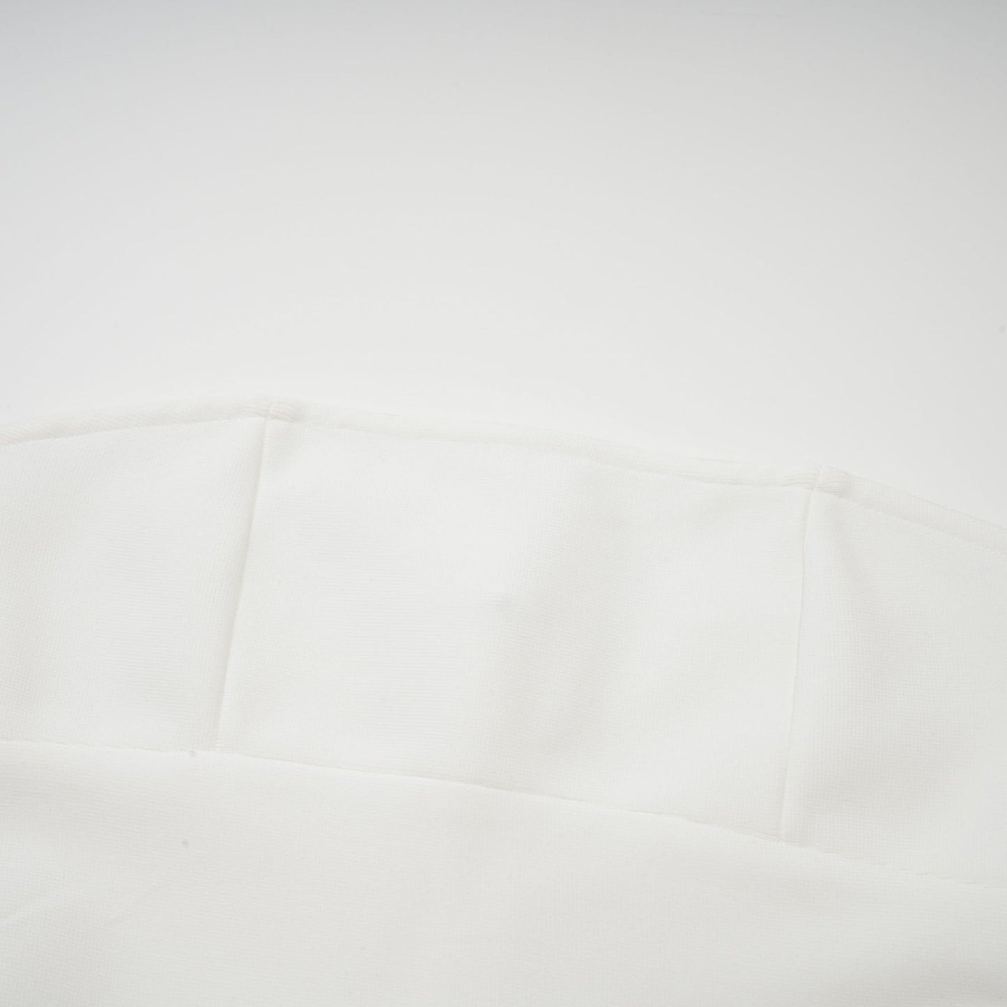 A long white maxi dress with tulle panelling named Nathalie featuring a flowy silhouette and delicate sheer details