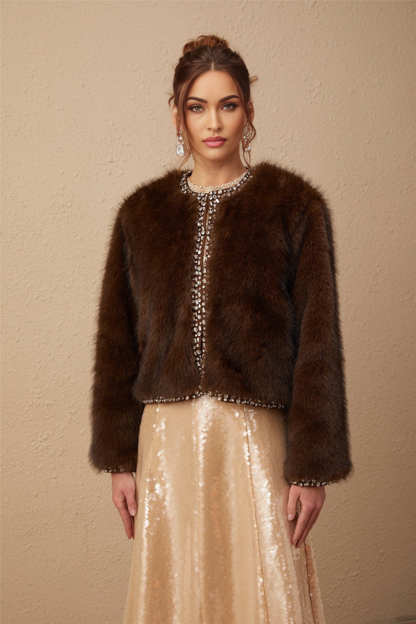 A luxurious ombre effect crystal faux fur coat in shades of blue transitioning from light to dark