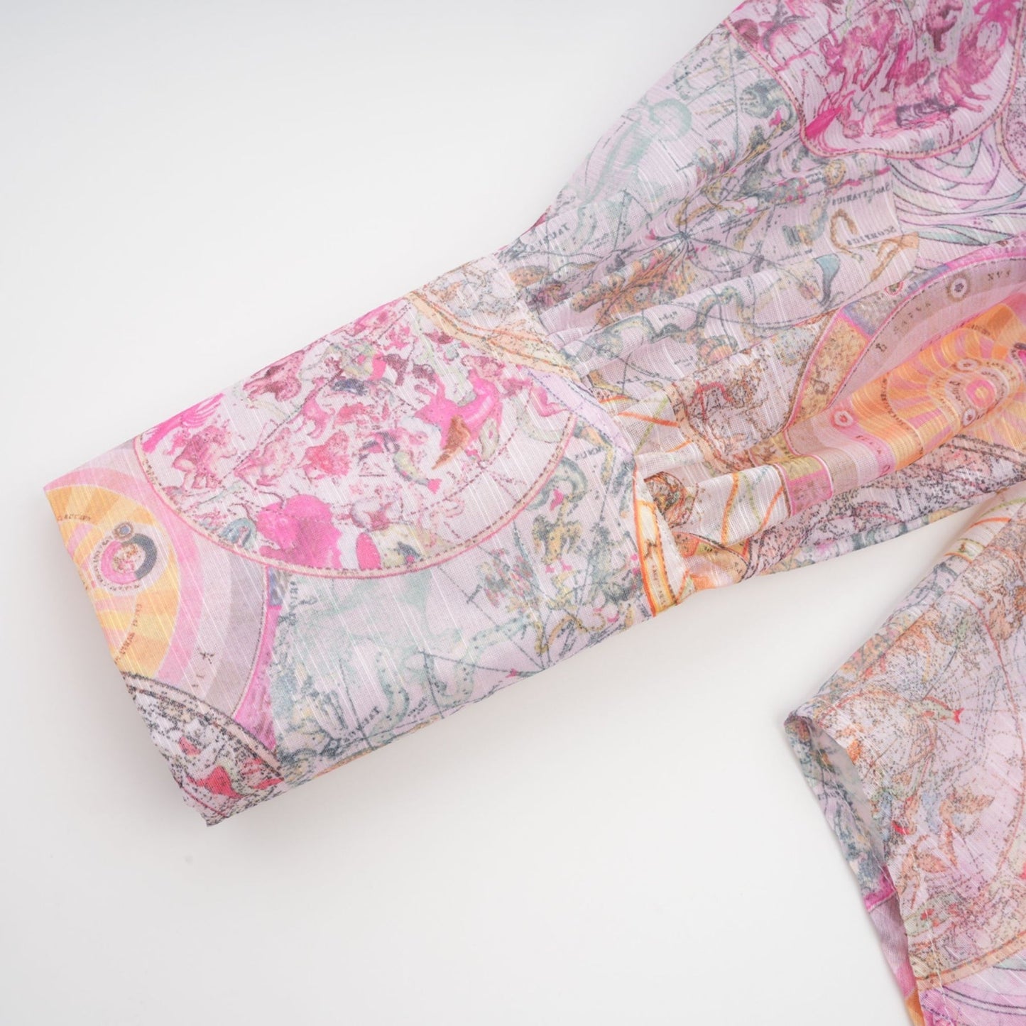A matching set consisting of a cherry pink shirt and skirt both featuring a pattern print design