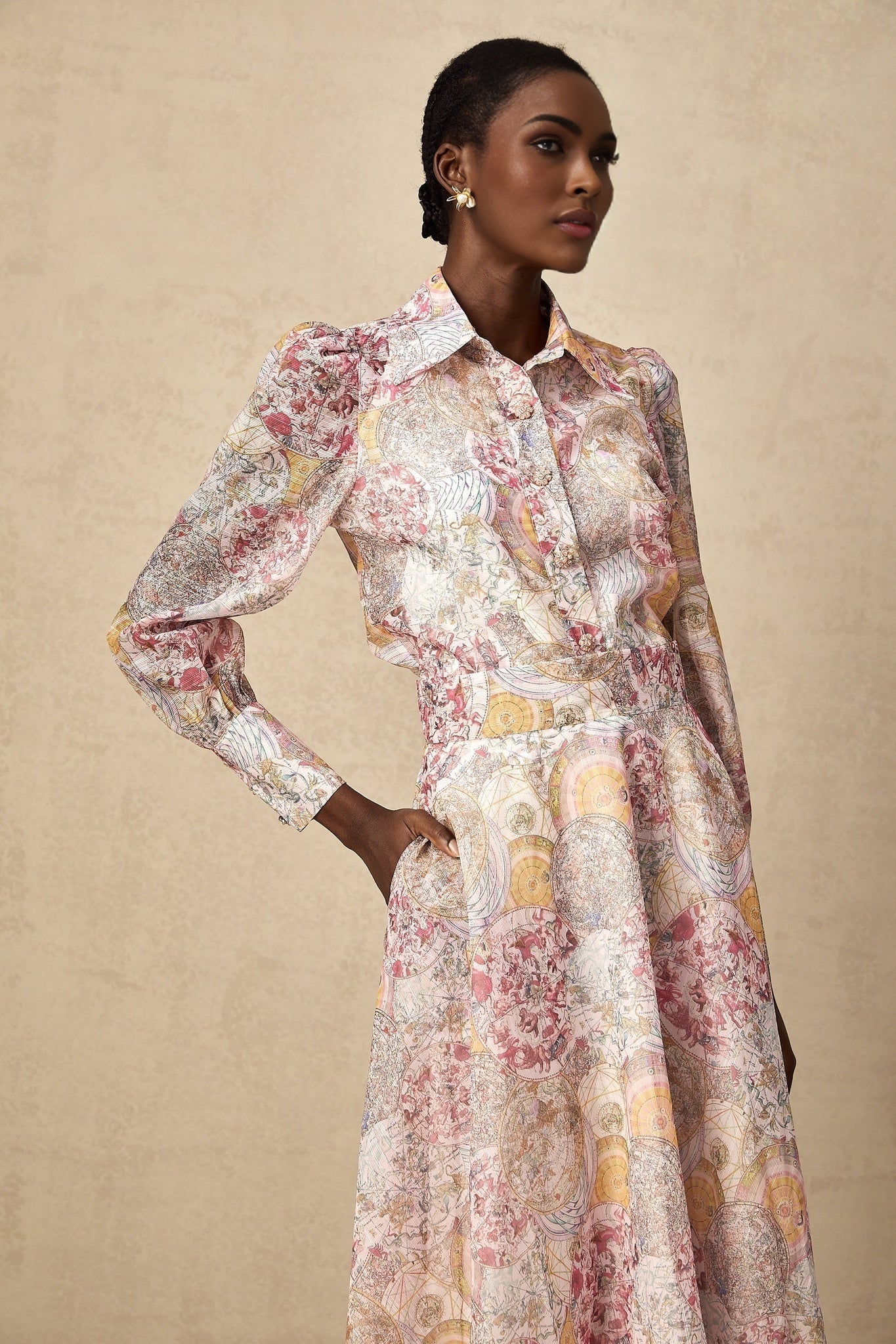 A matching set consisting of a cherry pink shirt and skirt with a pattern print design