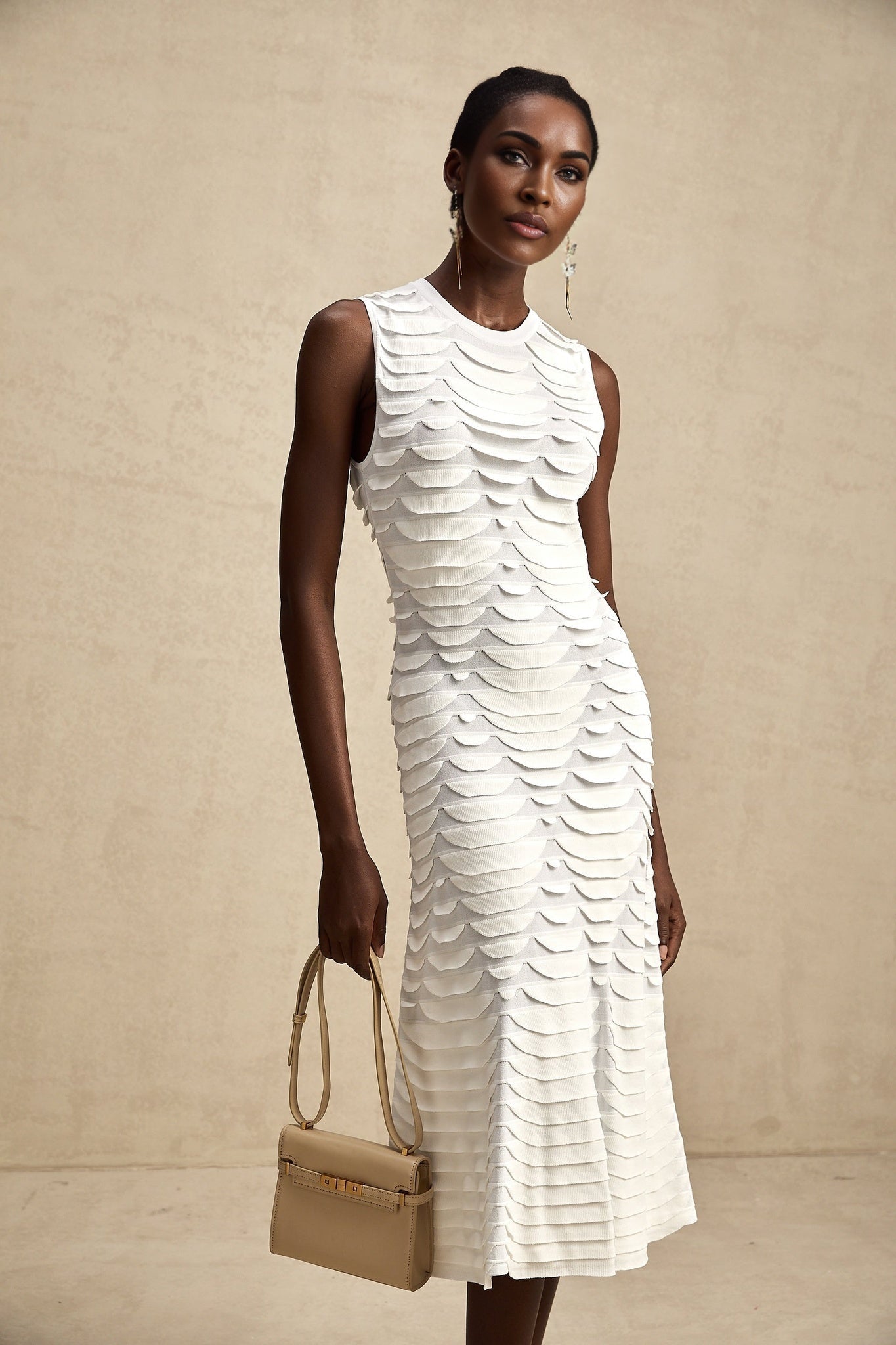 A midi dress with a snake pattern design featuring godet inserts and named Anna