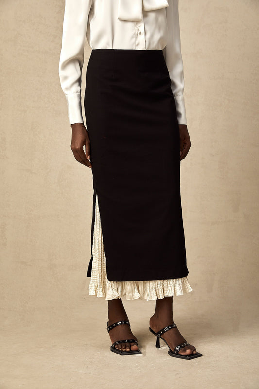 A midi skirt with colorblocked panels featuring contrasting hues and a modern silhouette named Heloise