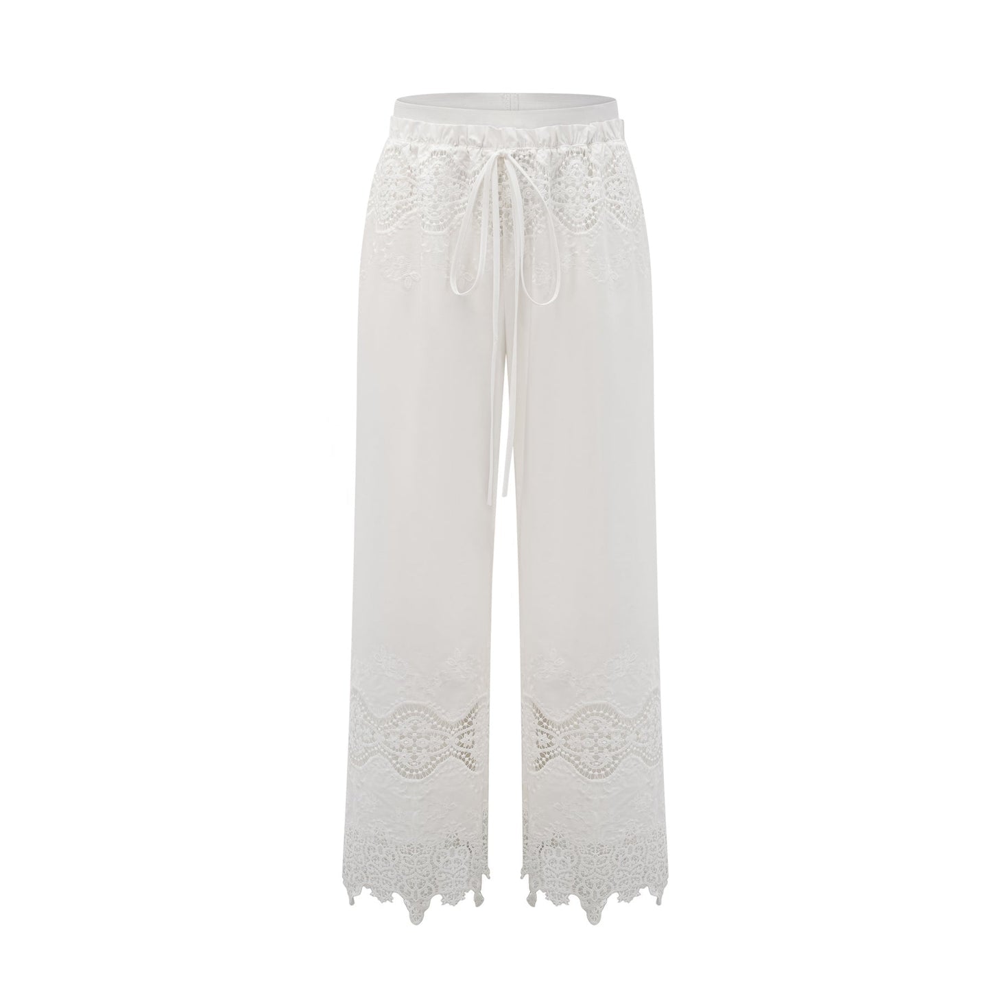 A model wearing a matching set consisting of a cropped top and trousers in white The top features lace trim and cutout details The trousers are high waisted and flared The set has a romantic and feminine style