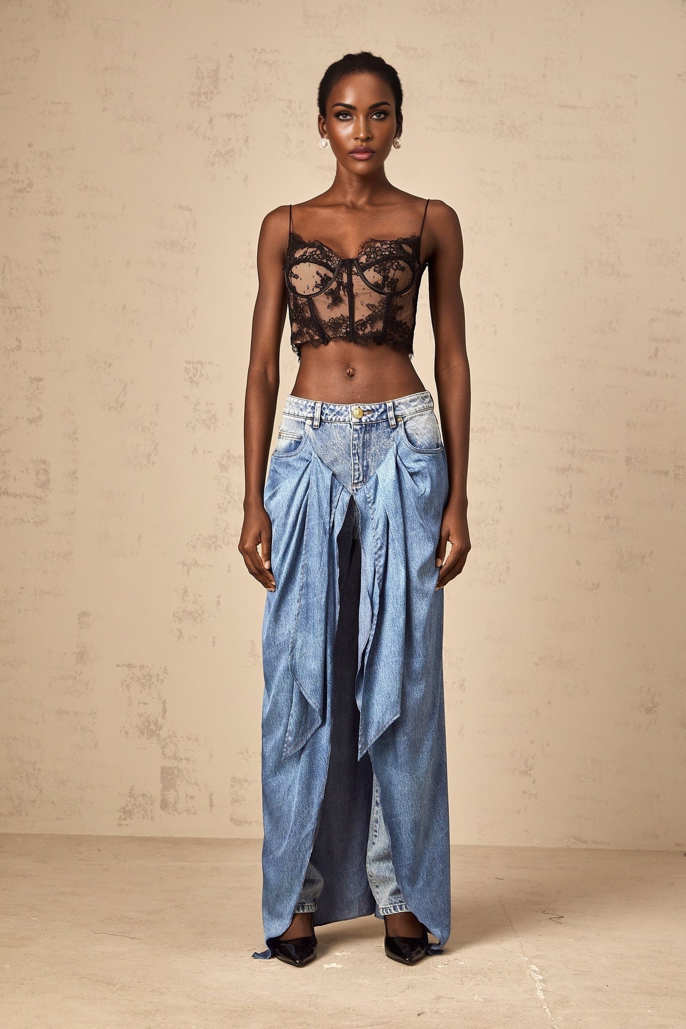A pair of blue layered denim jeans called Ysabella featuring multiple fabric layers for a stylish and unique look