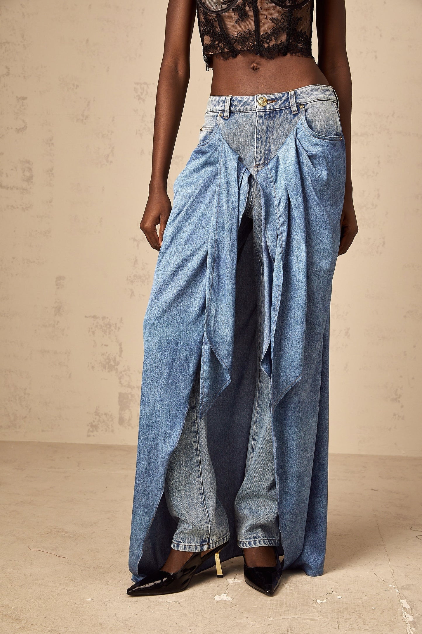 A pair of blue layered denim jeans named Ysabella featuring a stylish multitiered design